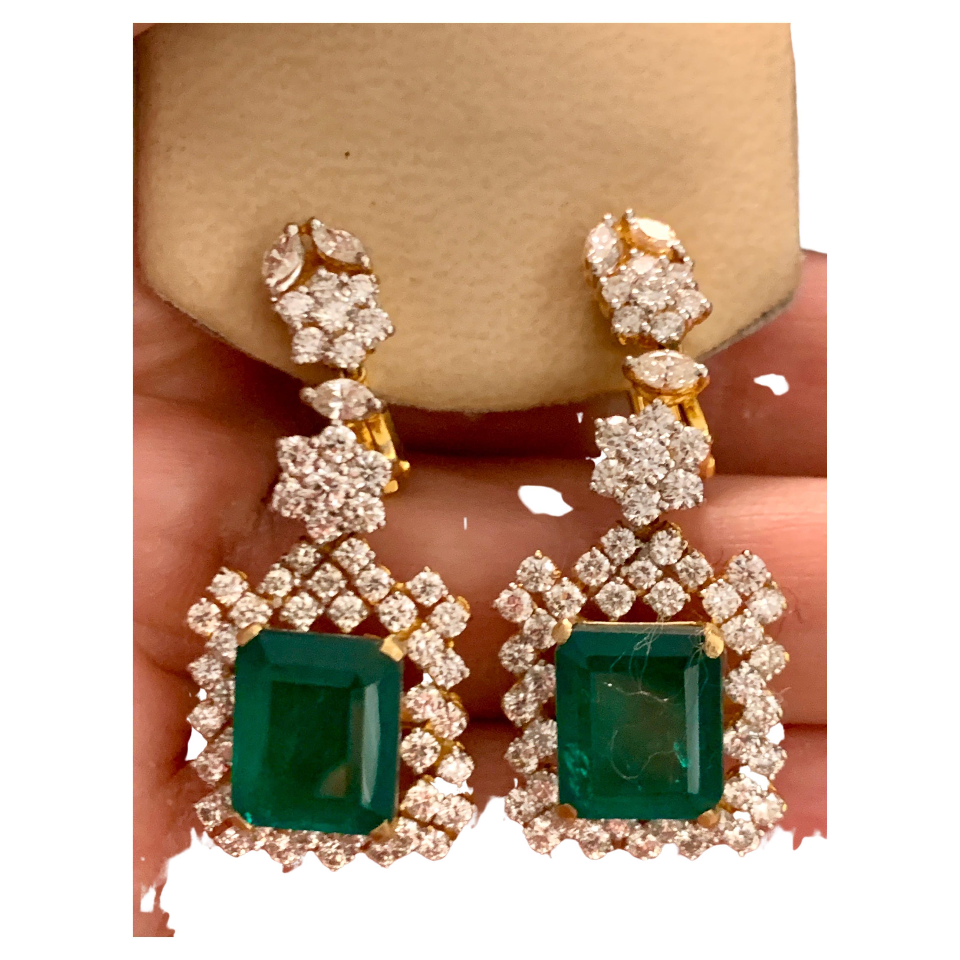 
10 Carat Hydro Emerald Cut Emerald, 7 Carat VS 1 quality and E/F color  Diamond Dangle/Drop Earrings 18 Kt Gold 
This exquisite pair of earrings are beautifully crafted with 18 karat Yellow  gold  weighing  18 gm 
Diamond quality is too nice . VS 1