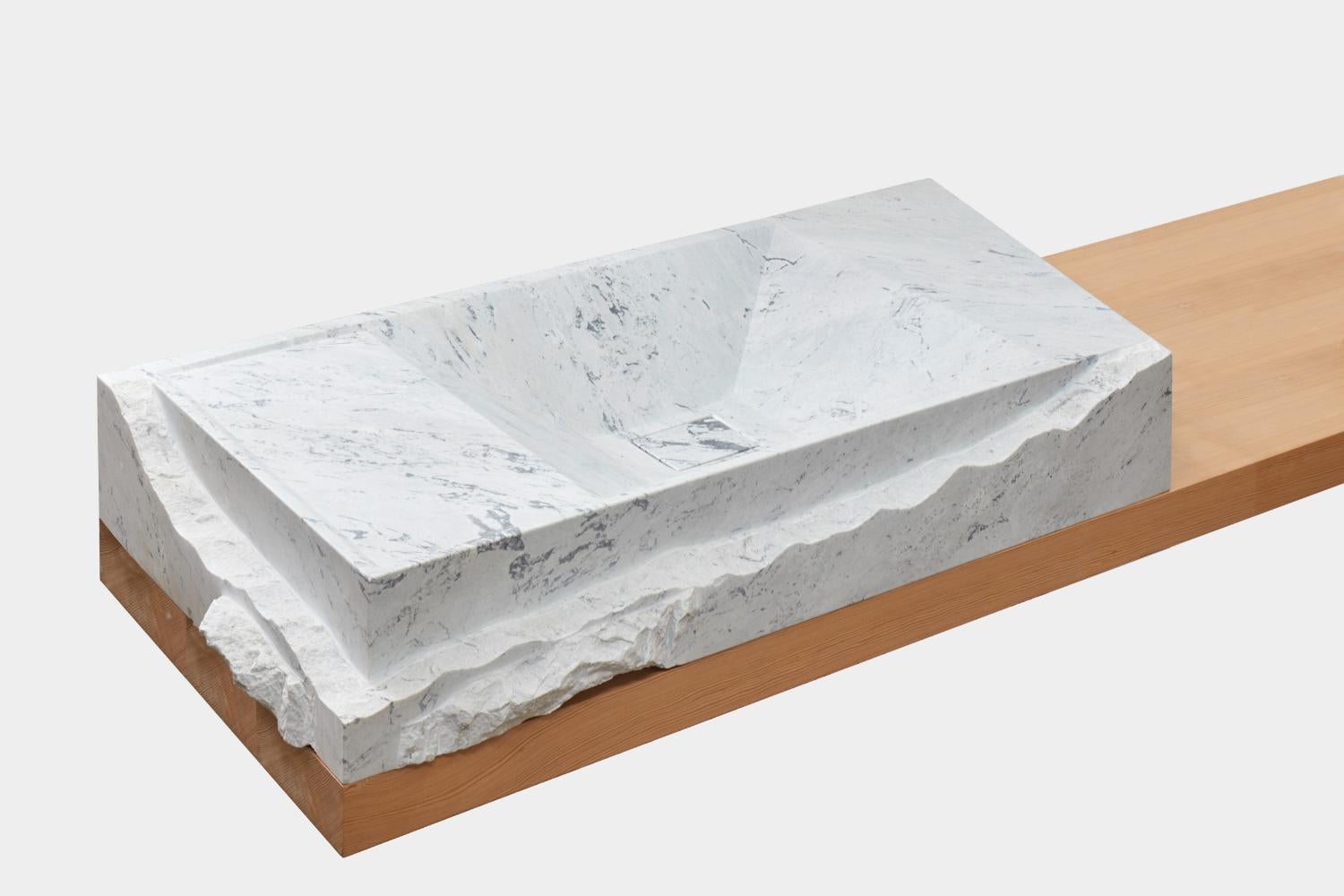 Hydrolytic N°2 by Estudio Rafael Freyre
Dimensions: W 120 D 60 x H 17 cm 
Materials: Andes marble.

The cultures that inhabited our territory developed the cult of water, creating a society and urban spaces articulated with this fundamental