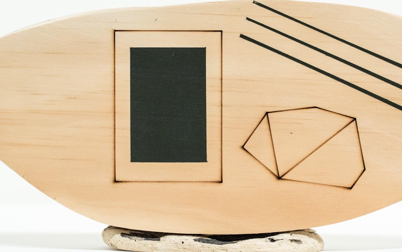 The small-scale wooden and found object, abstract, free-standing sculpture titled, 