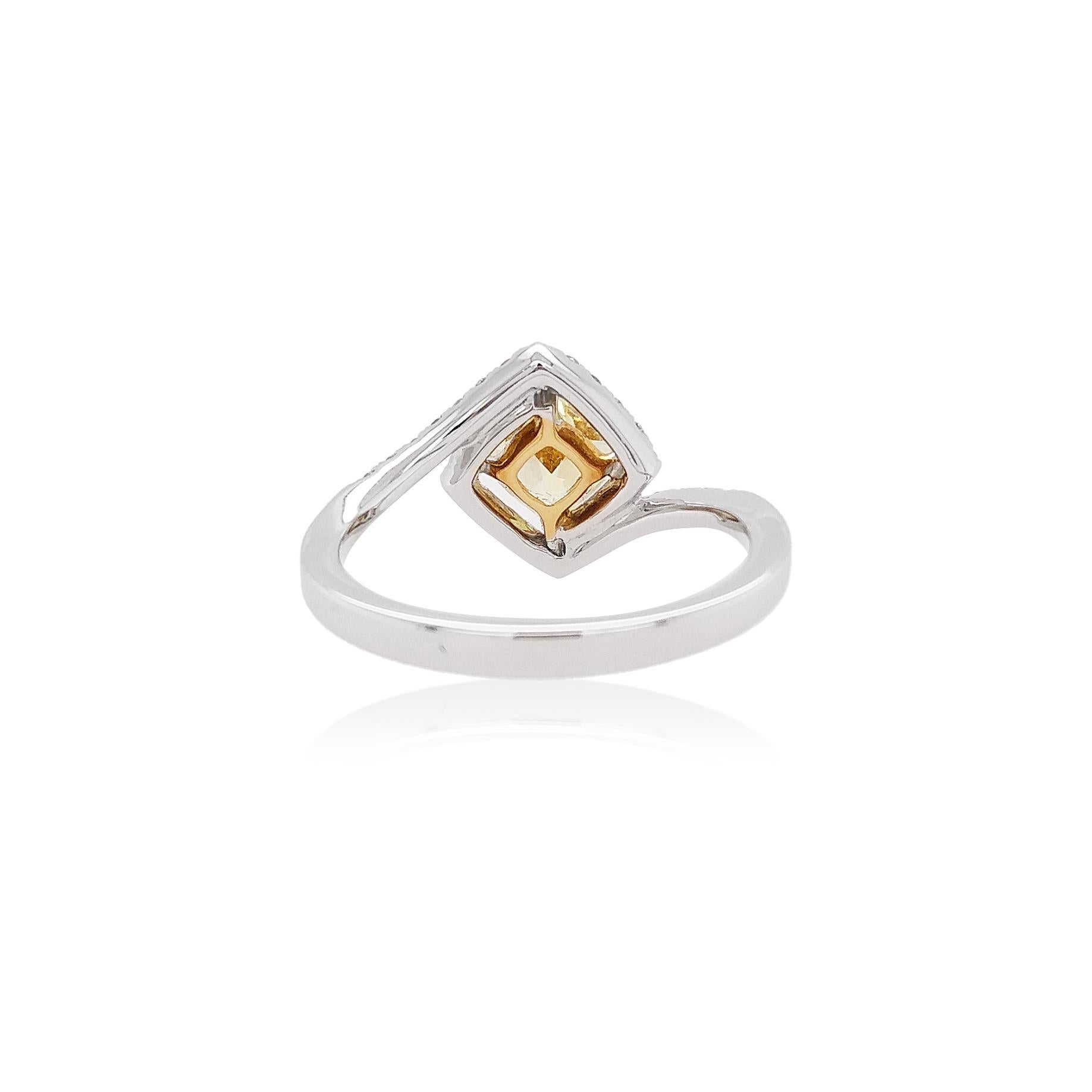 Featuring a Fancy Intense Yellow Diamond set amongst a diamond twist in Platinum and 18K Yellow Gold ring, this unique ring will add a striking finish to any outfit. Designed and hand-finished of this ring has been crafted to the highest standard. A