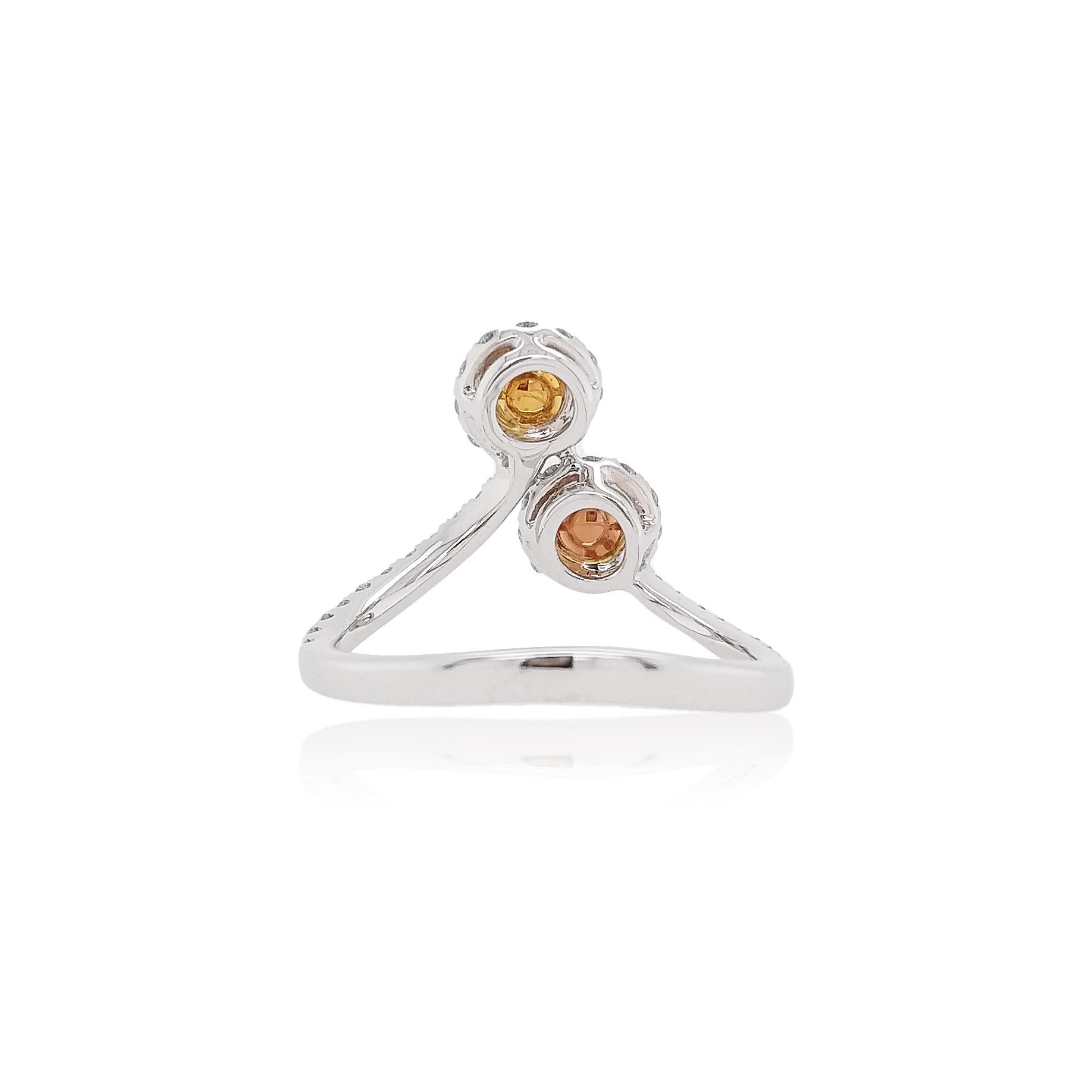 Inspired by the beauty of the light, it showcases the mysterious elegance of two colored diamonds. Featuring two different colored diamonds - pink and yellow, designed to elegantly rest upon the finger, combine this edgy cocktail ring with any