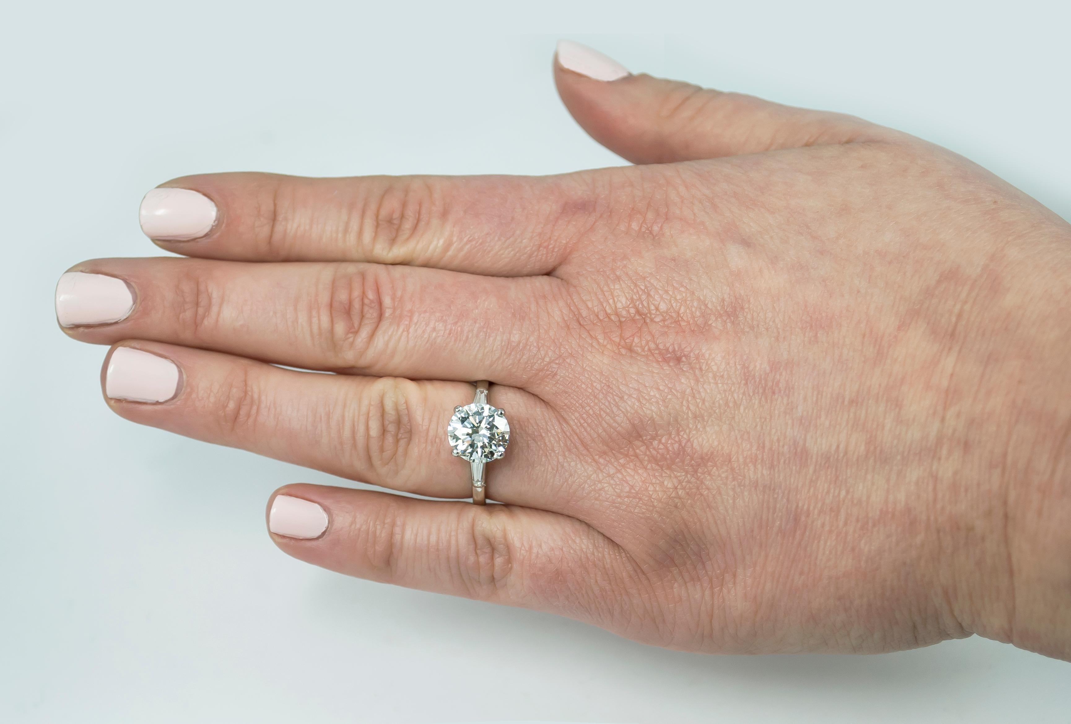 This elegant platinum ring features a GIA Certified 2.08 carat round cut diamond, flanked by tapered baguette diamonds for a refined, timeless look.

This diamond, graded E, offers a pristine, almost pure appearance, ideal for the most sophisticated