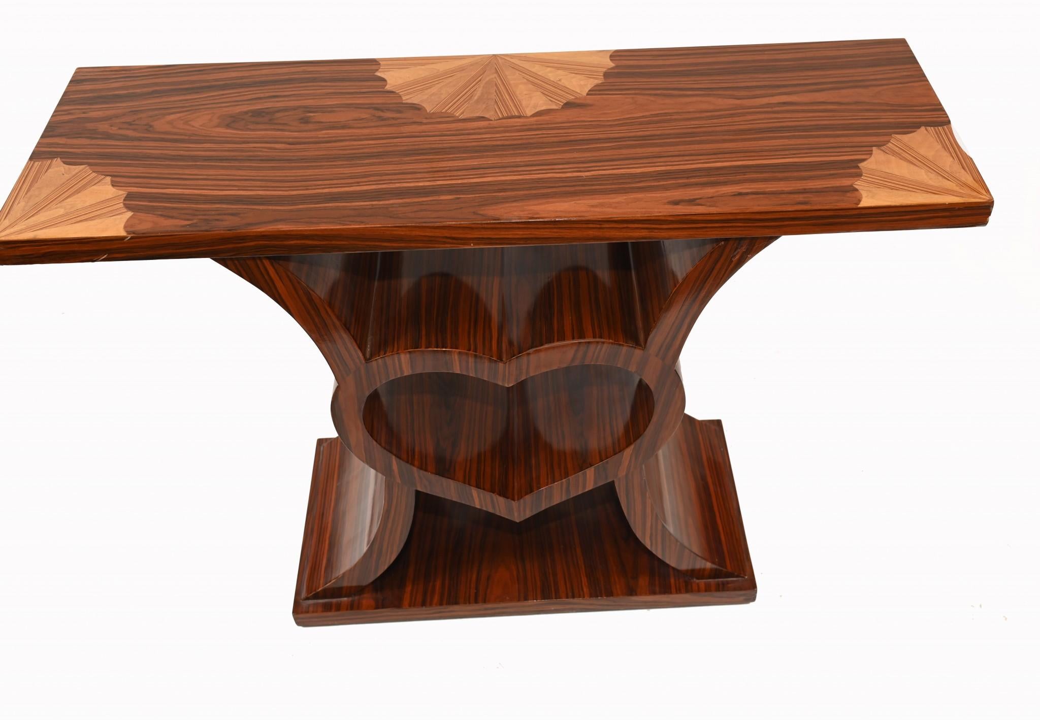 Unique and very cute art deco style console table with the central heart motif - we like!
Quality design piece, worthy of a space in the Victoria and Albert museum
Top has intricate inlay work embedded into main structure or rosewood
The clean and