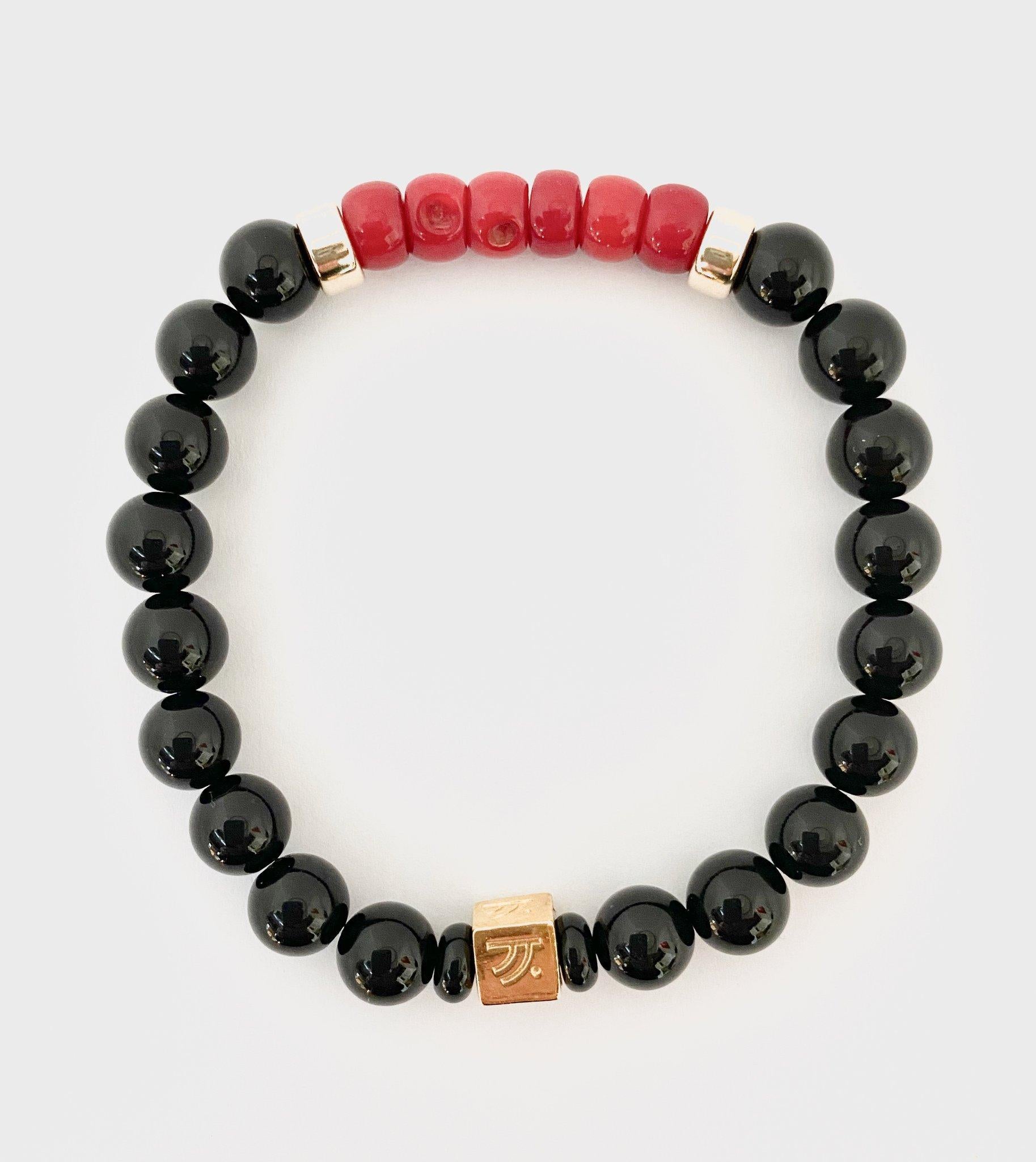 red and black beads meaning