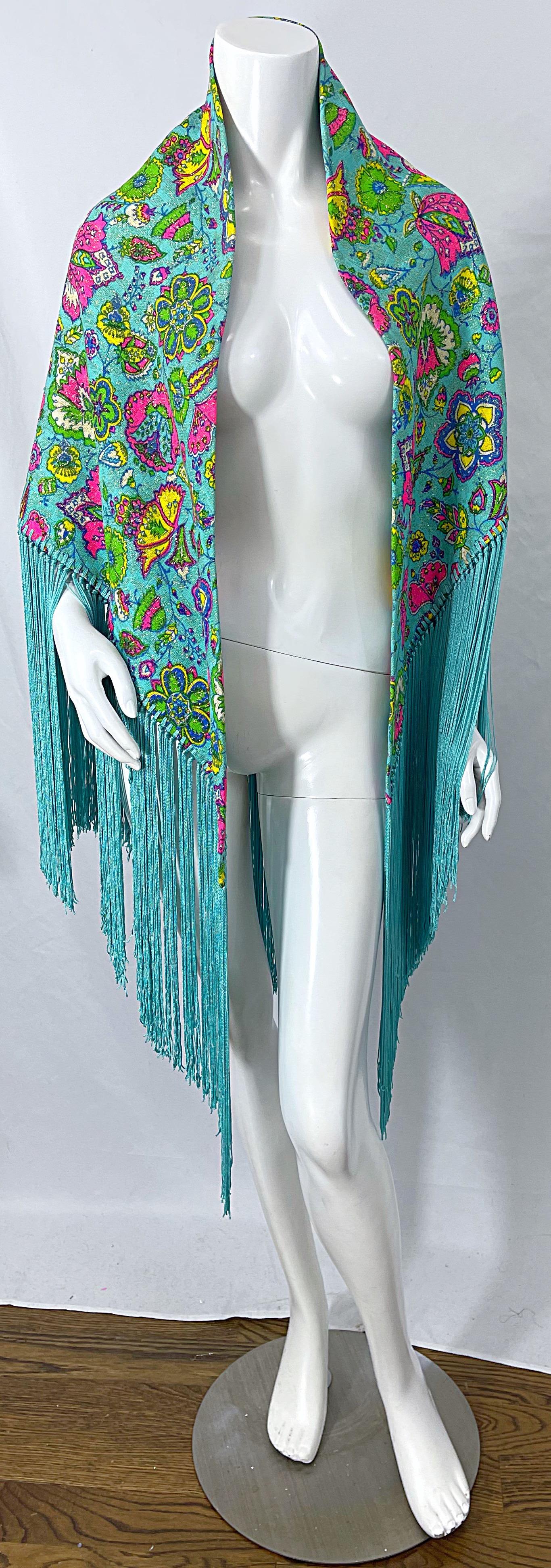 Brilliant large 1970s I MAGNIN turquoise / teal blue rayon fringed piano shawl ! Paisley print in vibrant colors of  fuchsia pink, purple, green and yellow throughout. Metallic gold thread throughout. Fringe hem. Can easily be dressed or down. Pair