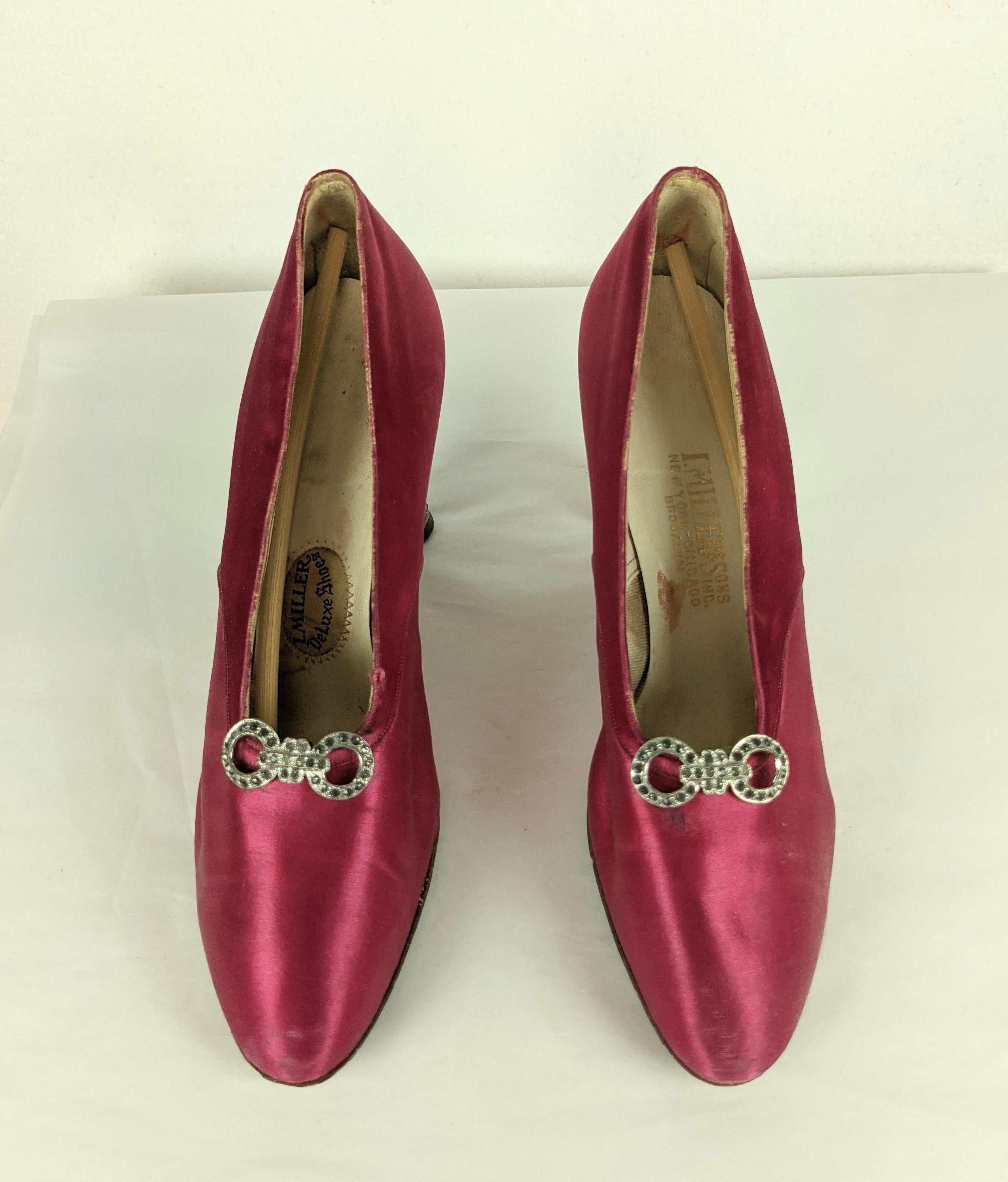 Elegant I. Miller Art Deco Satin Shoes with Pave Heels from the 1920's flapper period. Rasberry silk satin is accented with a crystal buckle motif and extravagant pave crystal heels. 
Tiny size not suitable for wear, labeled 4.5 A.
1920's USA.