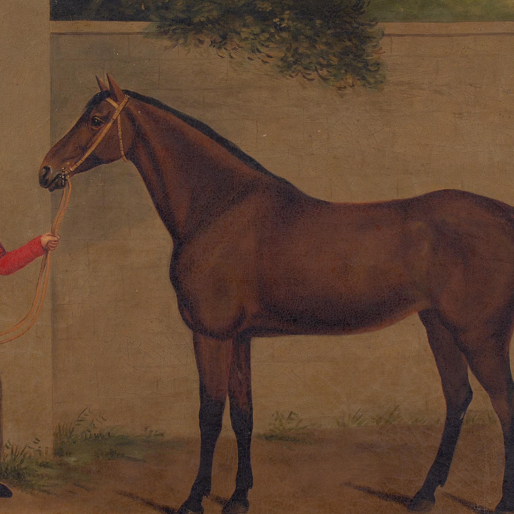 This early 19th-century oil painting by British artist I Moore depicts a horse with its dapper groom.

With his left hand clutching the reins, a smartly-attired young groom stands proudly alongside a bay mare. He’s dressed in a style befitting the