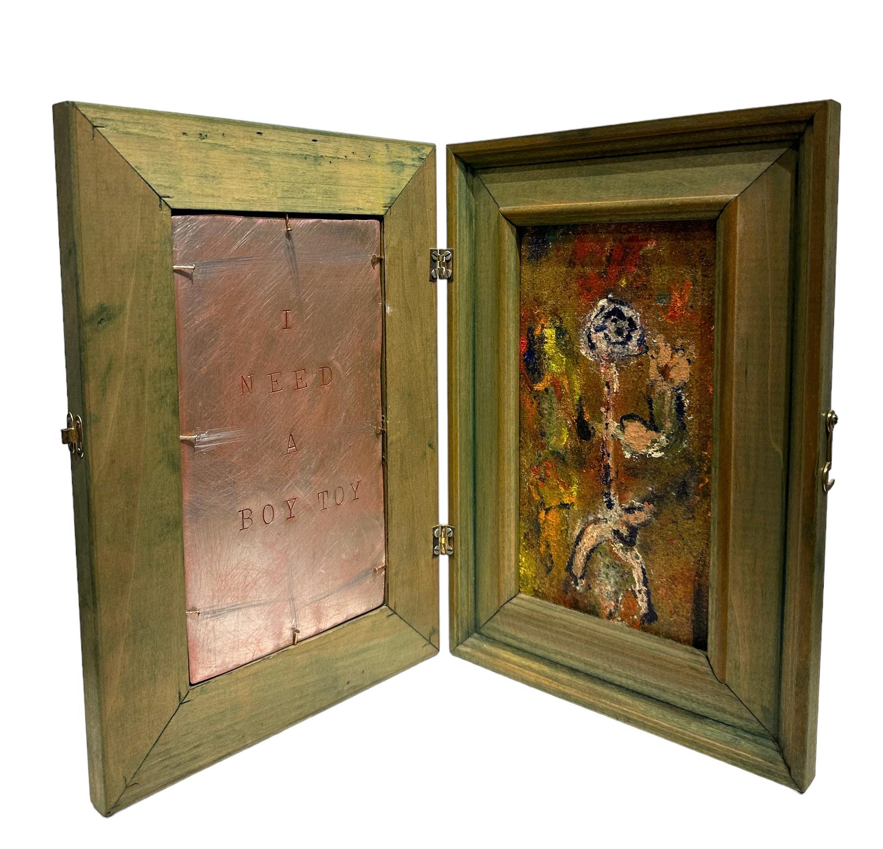 Self-taught artist John Seubert, AKA John Dolly, uses objects he uncovers as he rehabs older homes in Chicago. This piece has two frames that are hinged together.  A mirror adorns the outside.  When opened, the right panel has a primitive figure