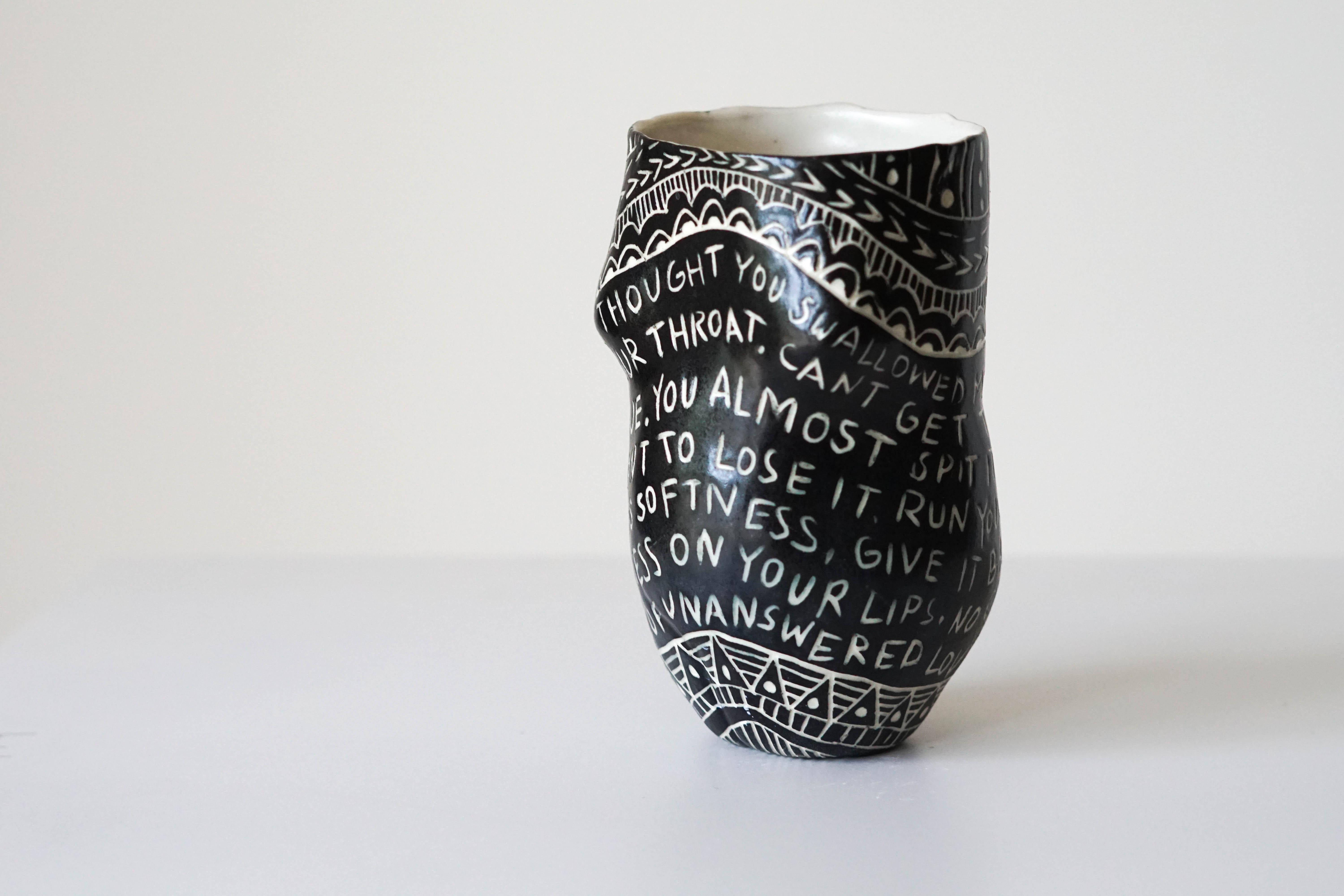 “I thought you swallowed my Love…”
Porcelain cup with sgraffito detailing


This cup is one of 48 that make up the installation, “Fragments of Our Love Story.” These cups feature feminine forms that recall the Venus of Willendorf and other