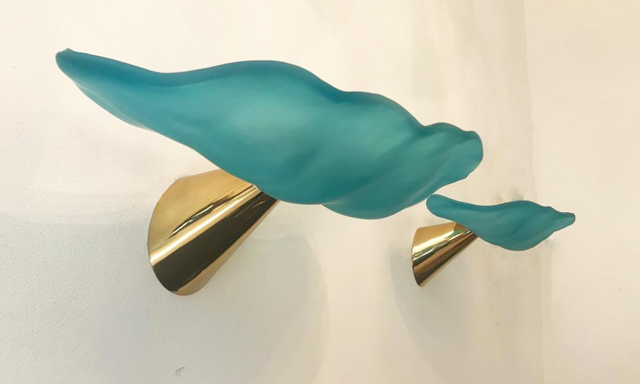 Turquoise hand blown glass wall lights
Designed by I Tre, Italy 1980
Brass-plated cone shape mounting
Gives off warm beams of light
Wired to the American standard
Located in our store in Miami ready for shipping.
2 pairs available now
Priced per