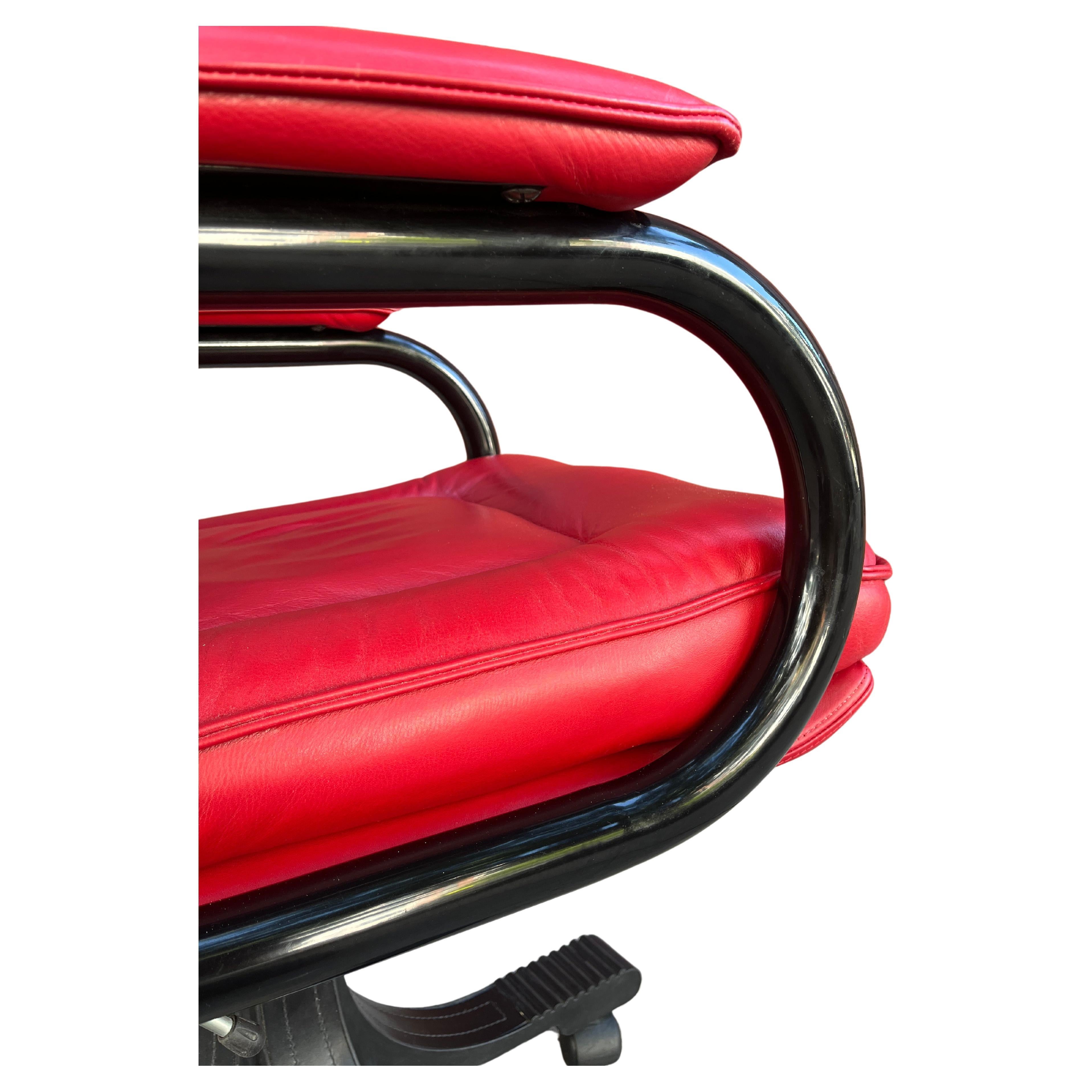 Butter soft red leather  surrounds this amazing Guido Faleschini swivel management soft pad chair. Designed for i4 Mariani and retailed in the 1970s and 1980s by The Pace Collection. Underneath the chair is a telescoping mechanism to raise/lower the