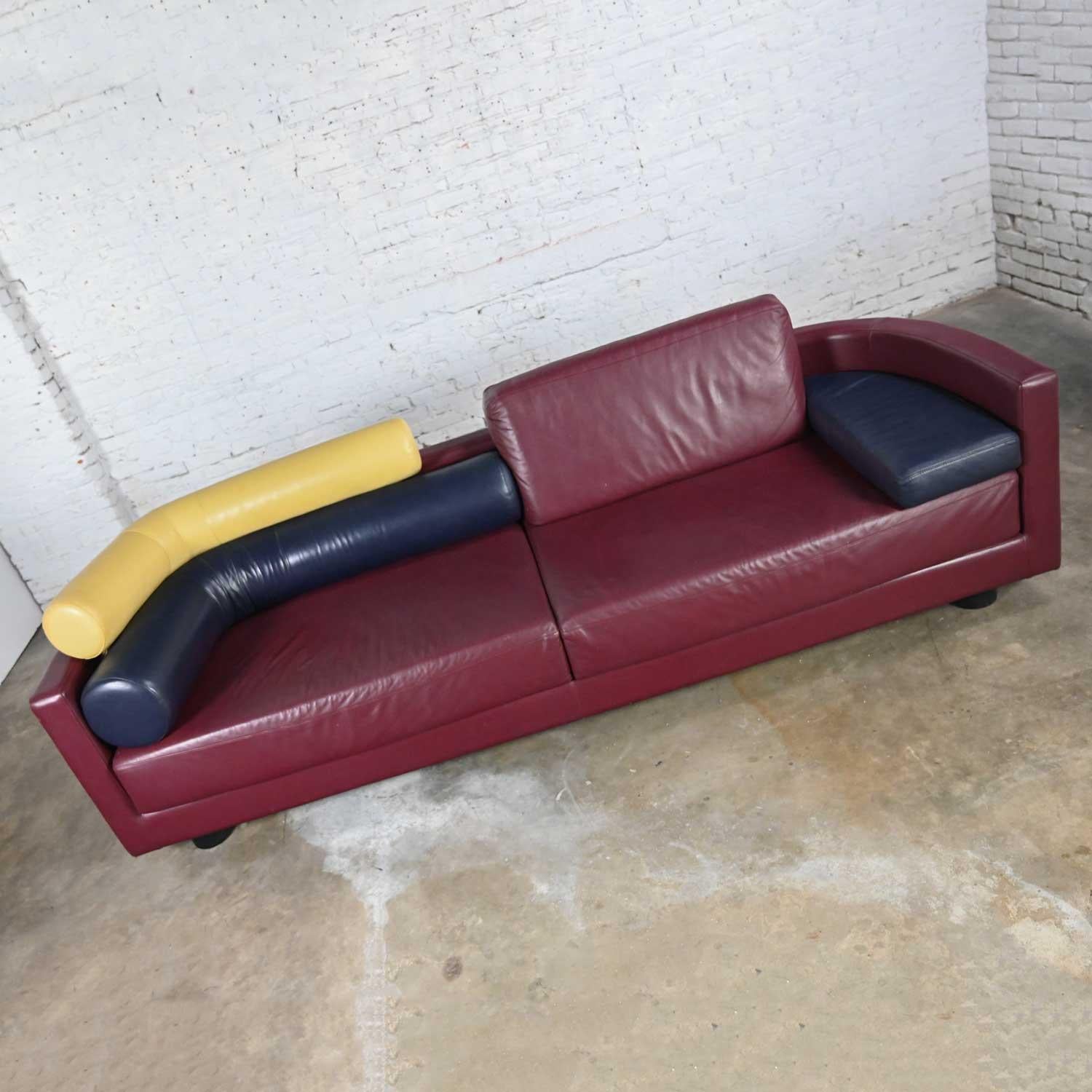 Spectacular postmodern Italian Molto + Di maroon leather sofa by Tittina Ammannati & Vitelli Giampiero for I4 Mariani. Beautiful condition, keeping in mind that this is vintage and not new so will have signs of use and wear. We have touched up a