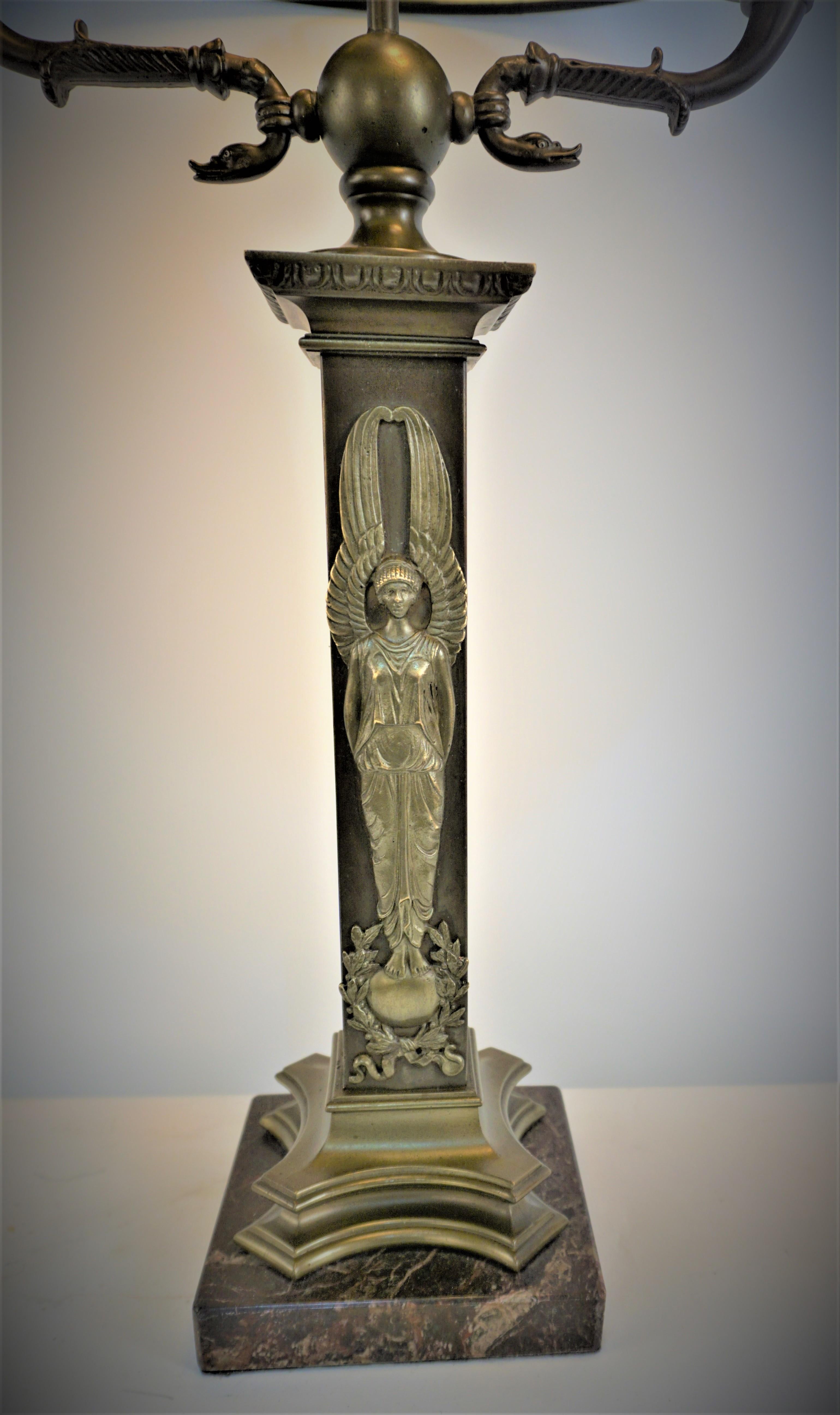 late 19th century electrified bronze marble base table desk lamp with black lamp shade.