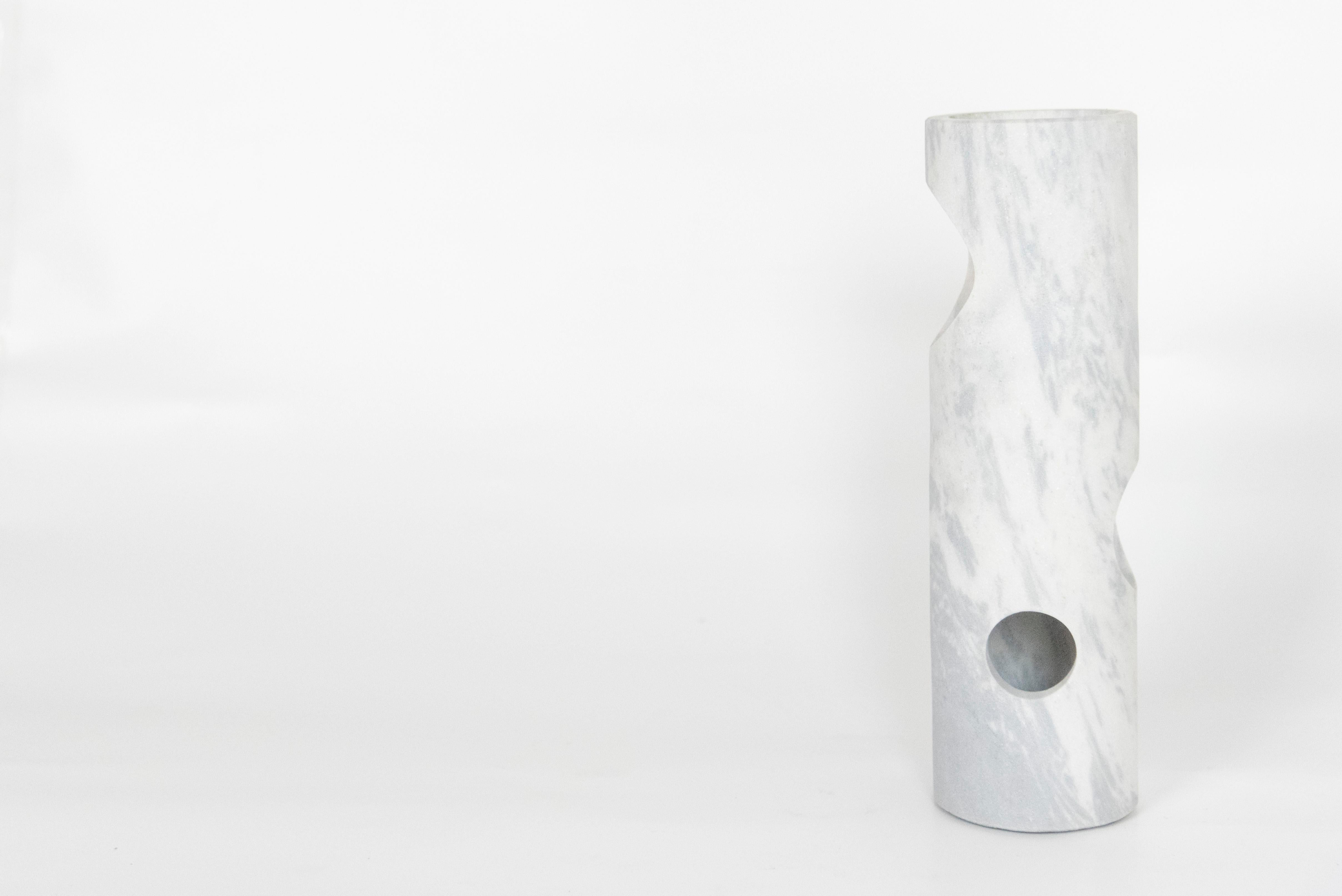 iaioi is a decorative vase.  
A space for imagination in Palissandro® Marble. 
A decorative vase playing with positive and negative space, between smooth and raw shapes.
The regularity of the holes - from the smallest to the largest - generate a