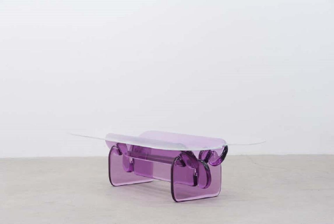 This coffee table is a continuation of the Plump series of furniture as sculpture by designer Ian Cochran. The transparency and rounded edges of the table make it both contemporary and futuristic at once, while bold color makes a striking statement