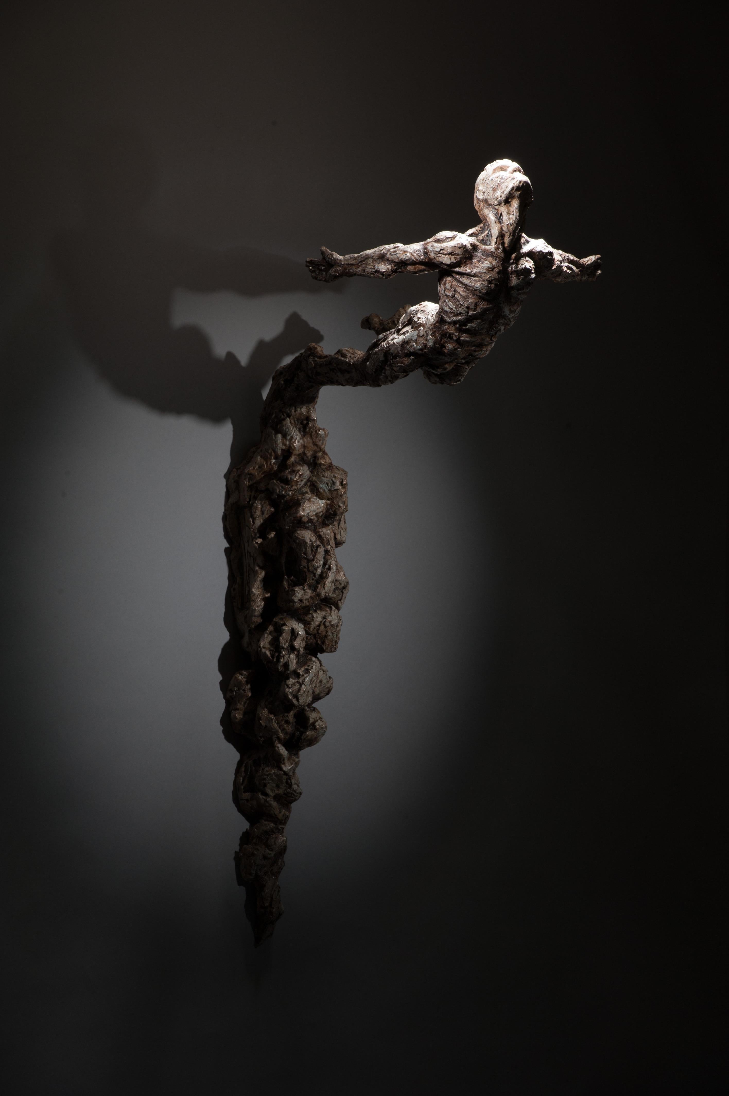 Ian Edwards Figurative Sculpture - Leap of Faith - Wall mount abstract figure Nude Male bronze sculpture modern art
