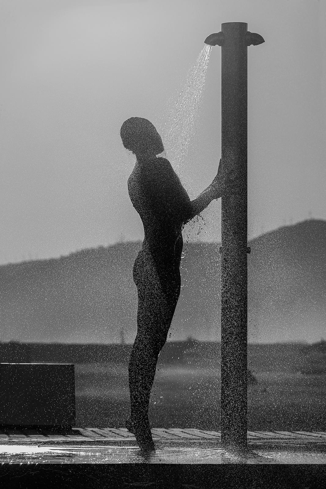 Ian Sanderson Figurative Photograph - Beach Shower - Signed limited edition fine art print, Black white photo, Model sea