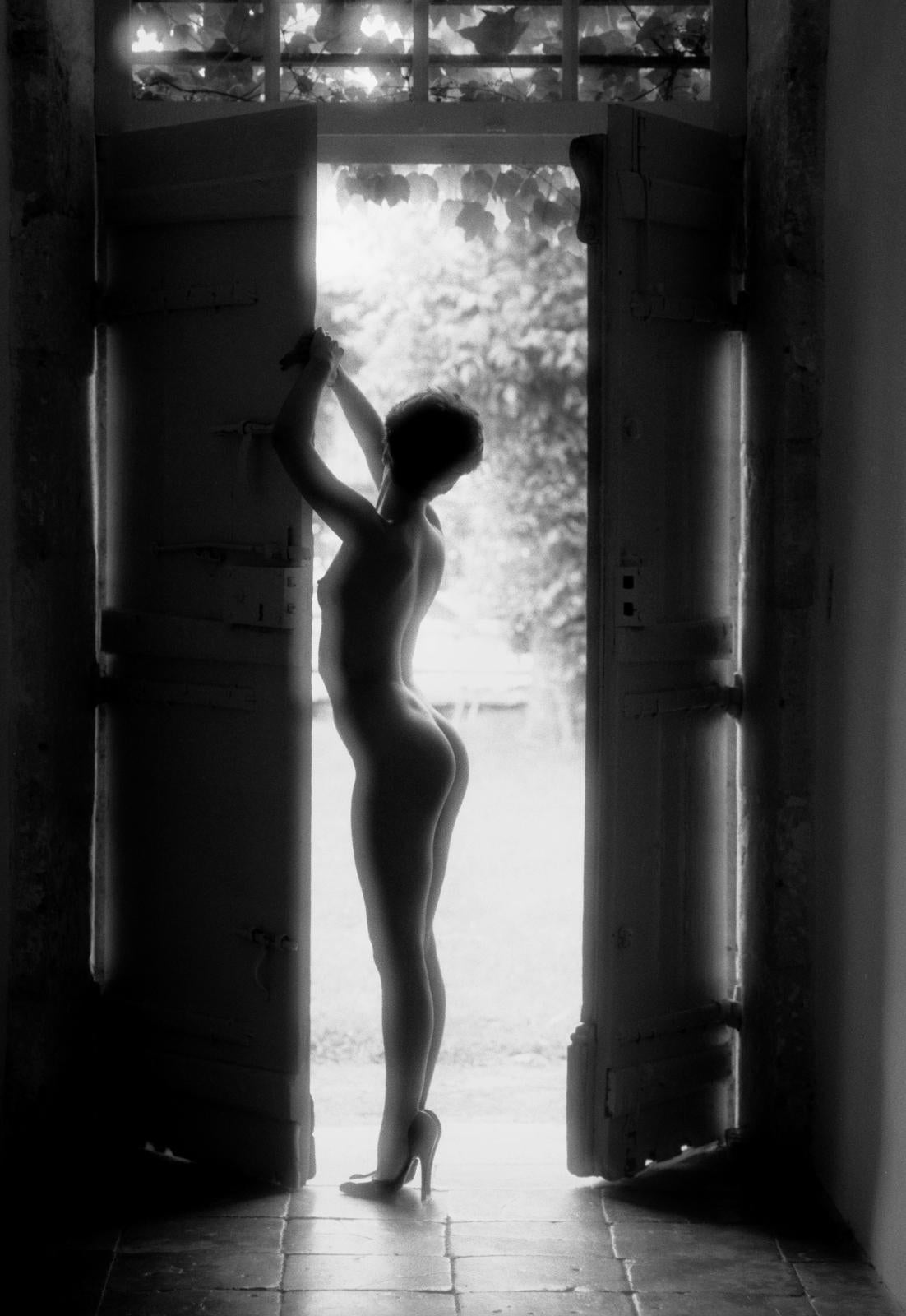 Lisa - Signed limited edition archival pigment print  , Edition of 10
Morning light in Bordeaux, France.     Lisa posed in the doorway of an old farmhouse

Ian Sanderson rented a castle near Bordeaux in France, surrounded by vineyards, for a long