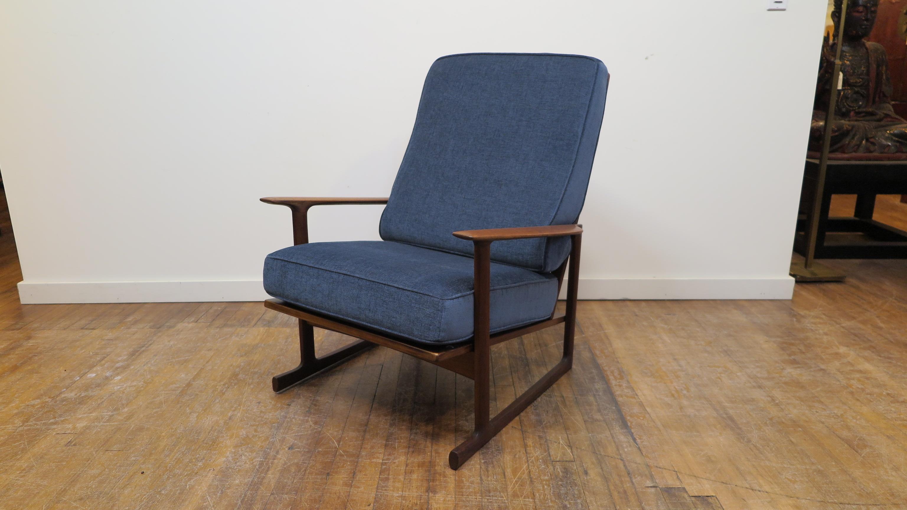 Ib Kofod-Larsen Danish modern high back lounge chair for Selig. Very comfortable lounge chair designed by Ib Kofod-Larsen with a taller back that is angled forward incorporating an architectural geometric back panel design. Danish import badge for