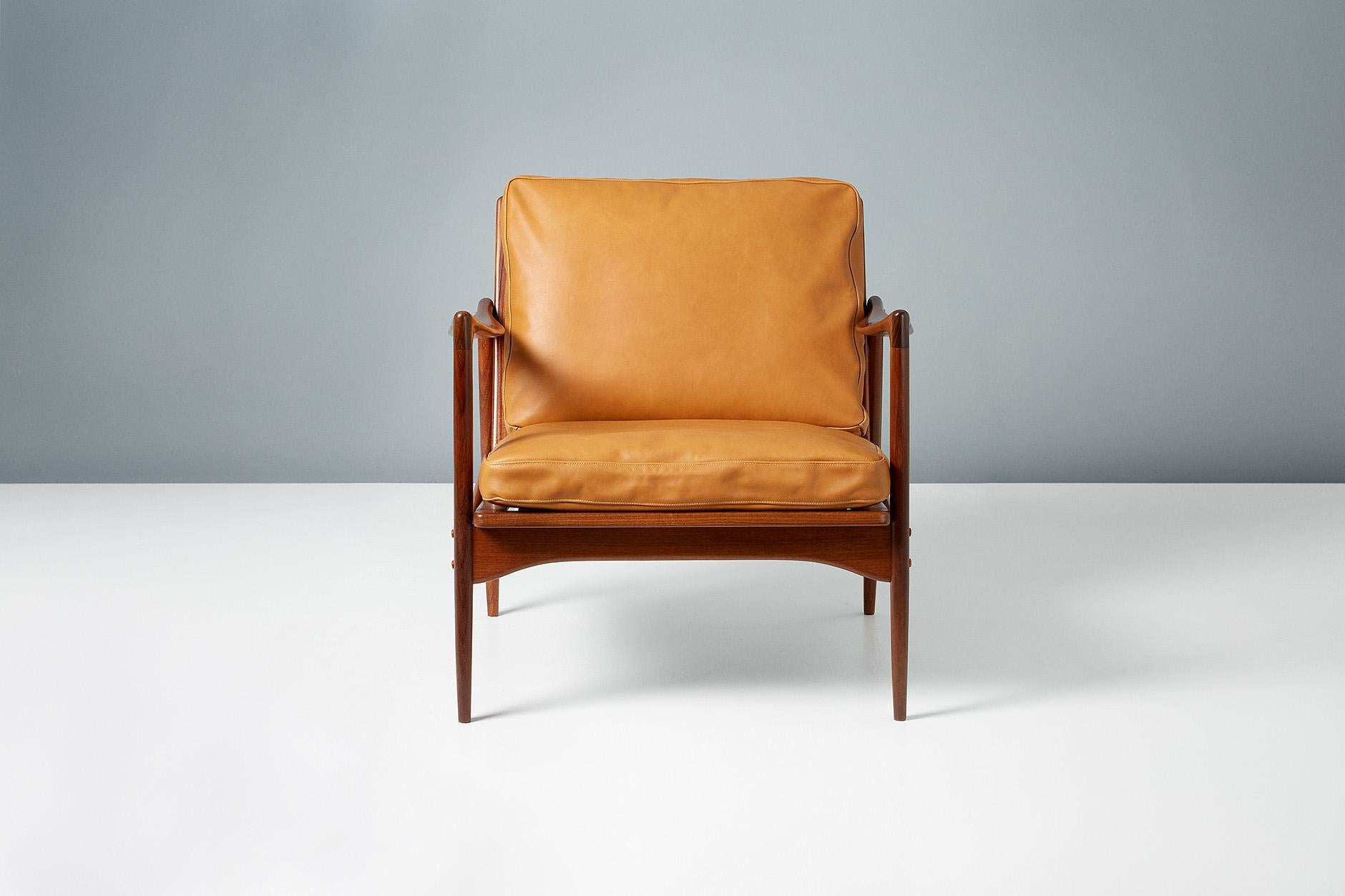 A pair of Afromosia African teak 'Kandidaten', (Candidate), lounge chairs produced by Olof Perssons Fatoljindustri (O.P.E.) in Jonkoping, Sweden, circa 1960. 

Danish master Ib Kofod-Larsen gained popularity in his native Denmark in the 1950s via