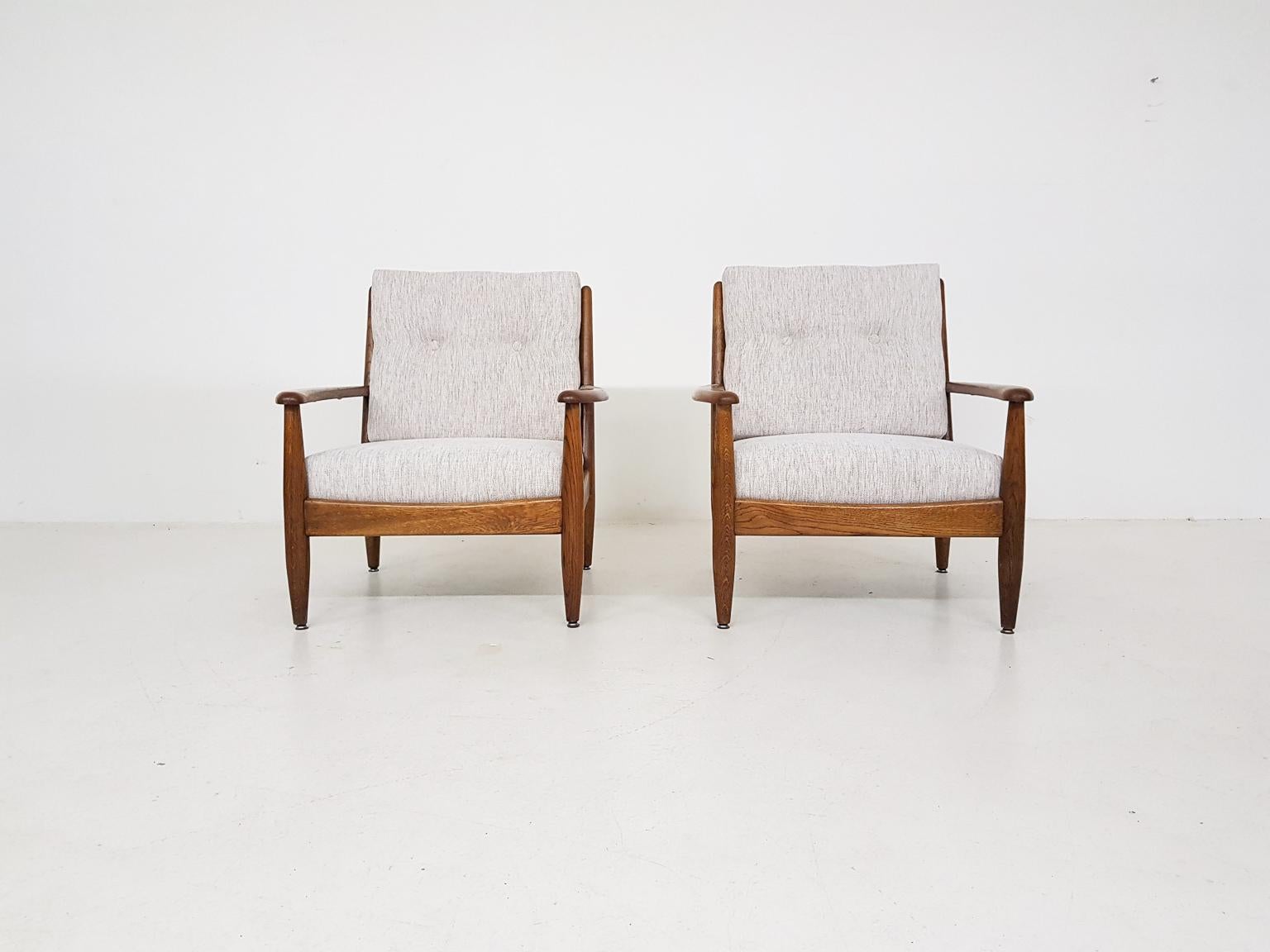 Solid oak frame and new cushions with new off-white upholstery.

We think they are made by Bovenkamp a Dutch midcentury Furniture producer. They have the same style and craftsmanship. Bovenkamp worked with Ib Kofod-Larsen and these chairs has many