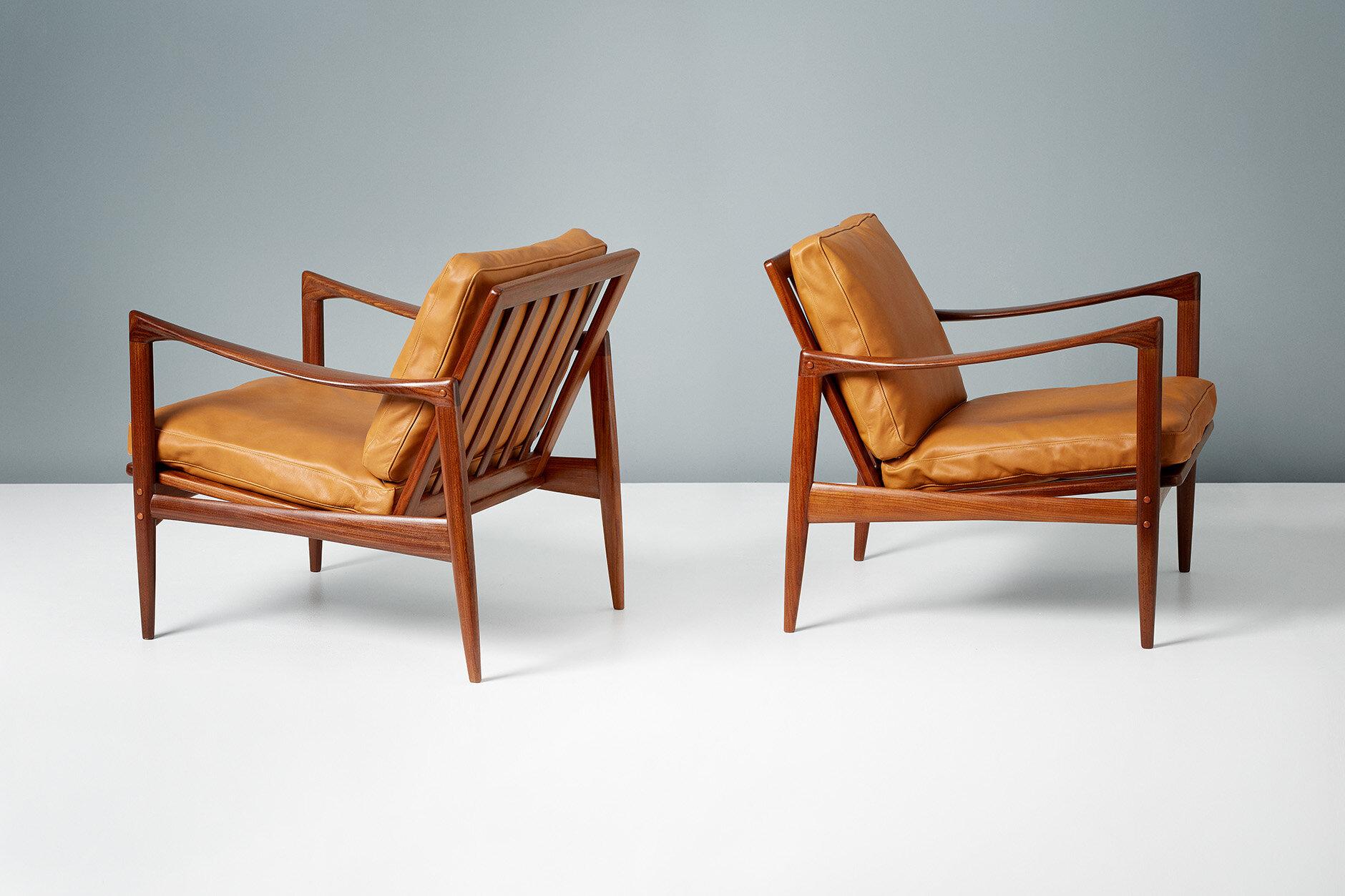 A pair of Afromosia African teak 'Kandidaten', (Candidate), lounge chairs produced by Olof Perssons Fatoljindustri (O.P.E.) in Jonkoping, Sweden, circa 1960. 

Danish master Ib Kofod-Larsen gained popularity in his native Denmark in the 1950s via