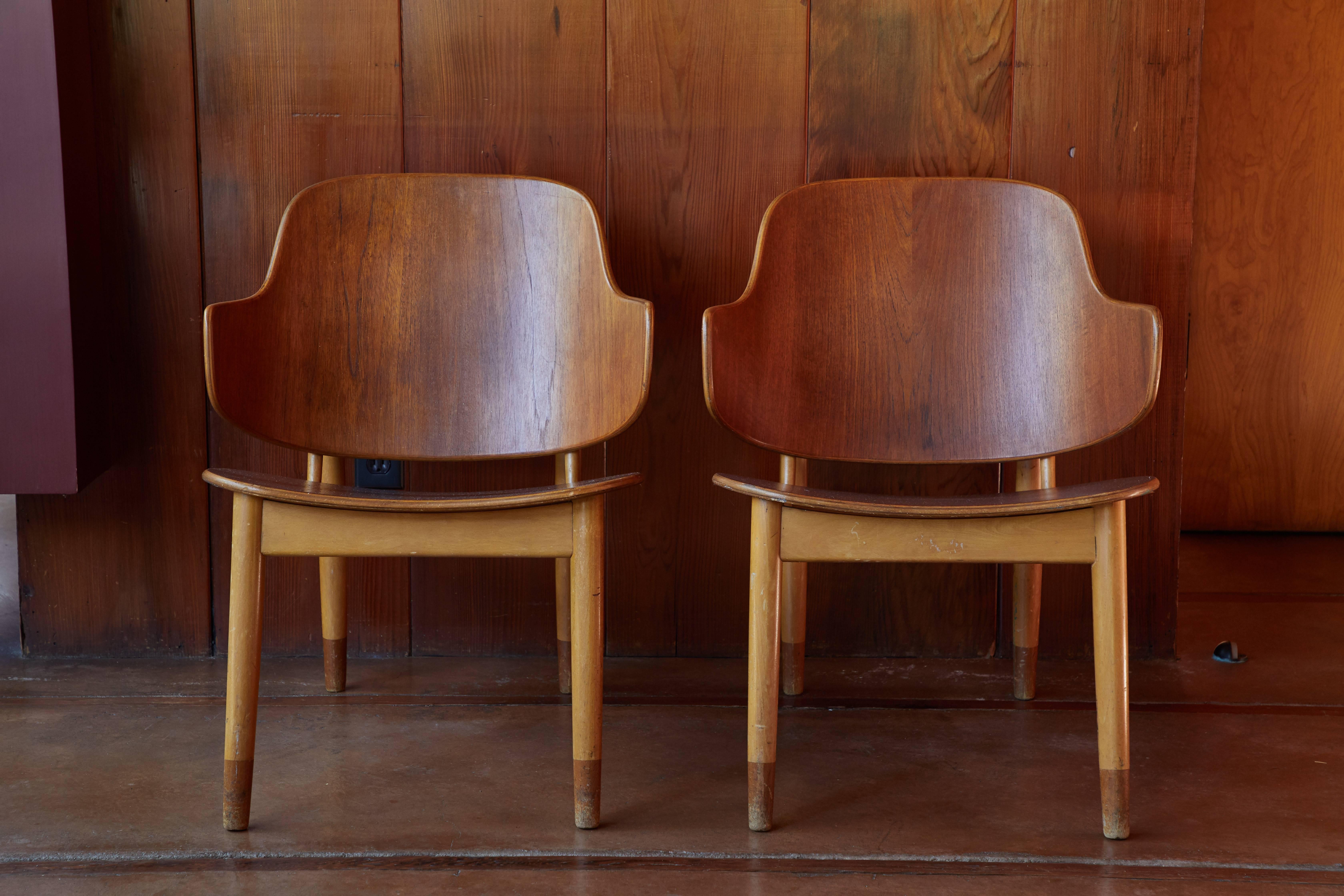 Ib Kofod-Larsen Chairs for Christiansen & Larsen. Designed in the early 1950s by Kofod Larsen and manufactured by Christensen & Larsen A/S in Denmark. A quintessentially clean and ultra refined example of the Danish Modernist aesthetic at its very