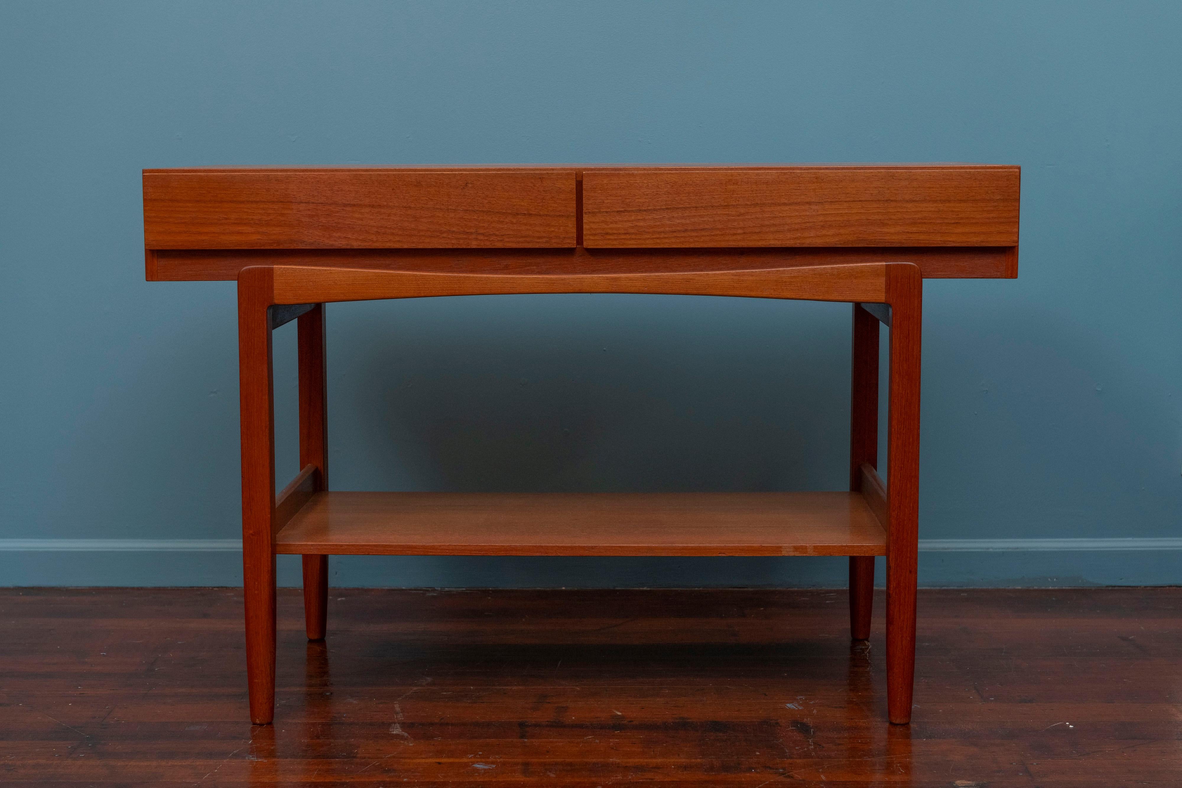 Ib Kofod-Larsen design console table or server. High quality construction and attention to detail, made from Burmese teak. Perfect for an entry way or as a dining room server. In very good original condition, ready to install and enjoy.