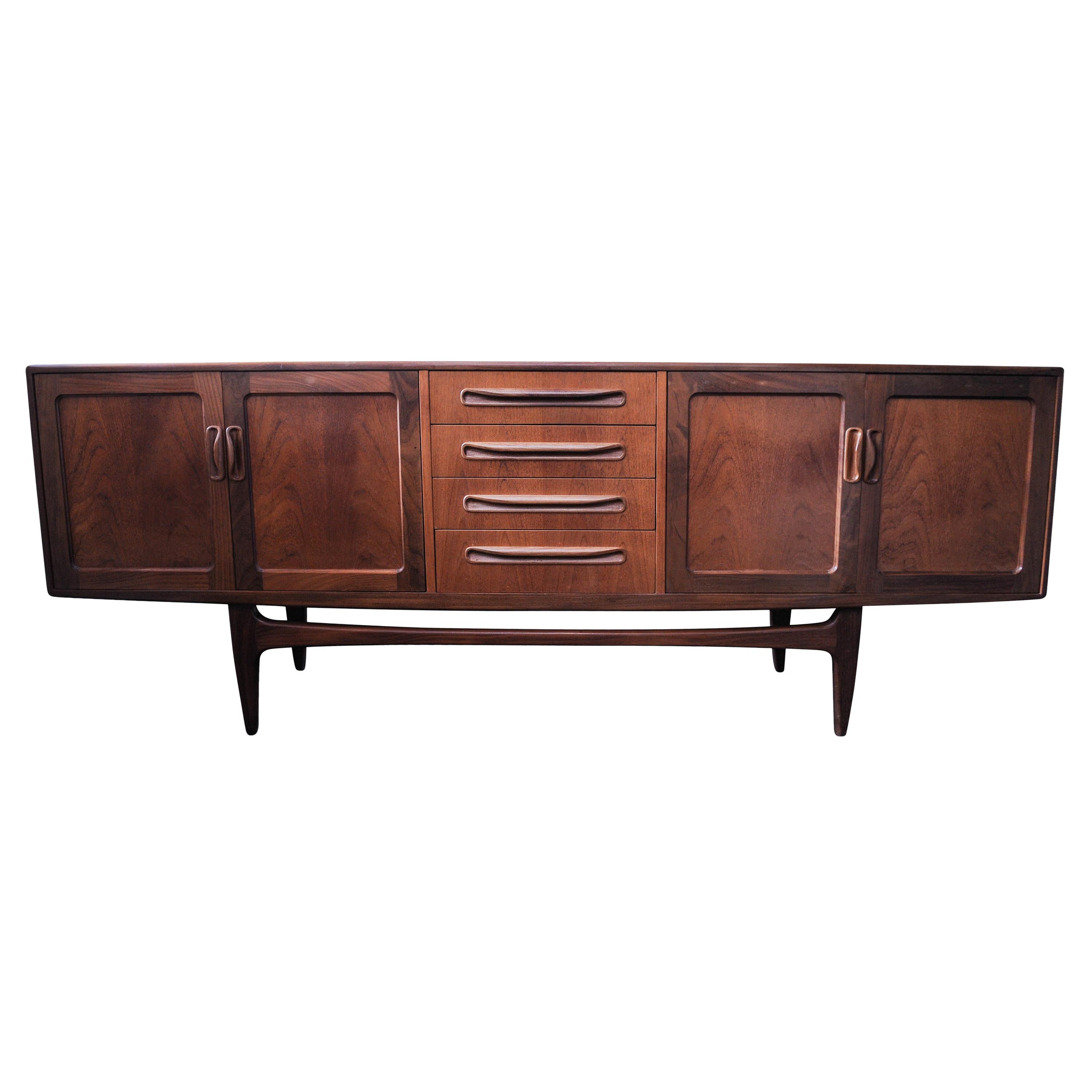 Ib Kofod-Larsen Danish midcentury teak sideboard or credenza for G Plan 1950s.
Storage space includes 2 side cupboards and 4 drawers.
Item is in great condition for the age of the piece with hardly any wear or tear.

G PLAN red label to inside