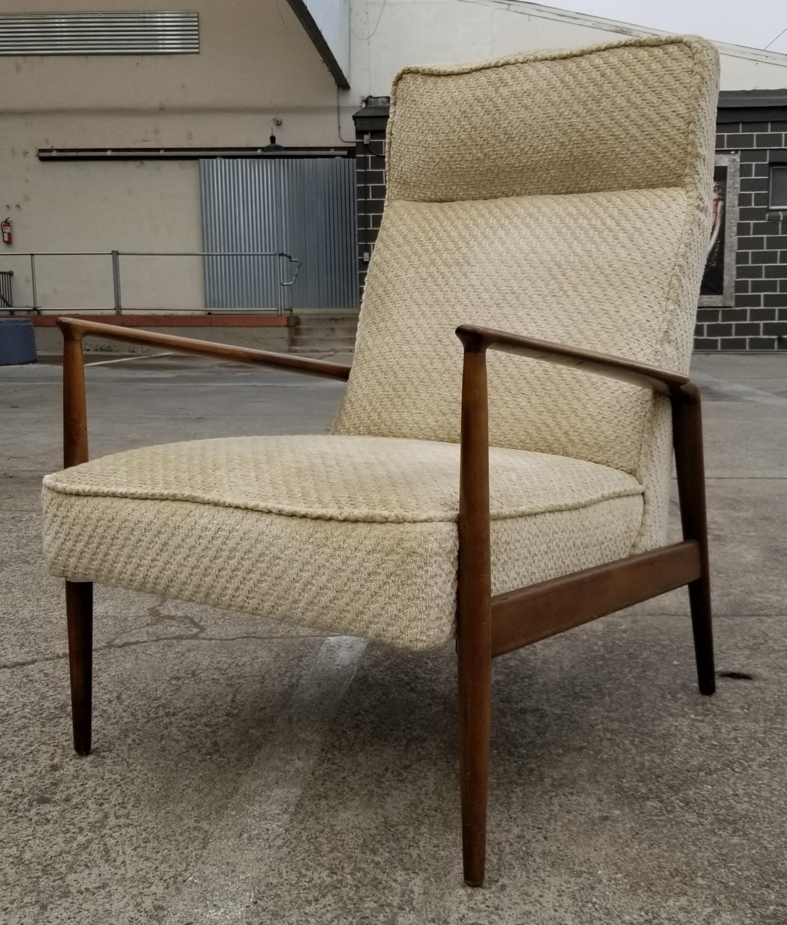 Danish modern high back lounge chair by Ib Kofod-Larsen, Denmark, circa 1960s. Original finish to beech wood frame. Older re-upholster has fading, foam is good, therefore, could be enjoyed as found, but new upholster recommended.

Ib