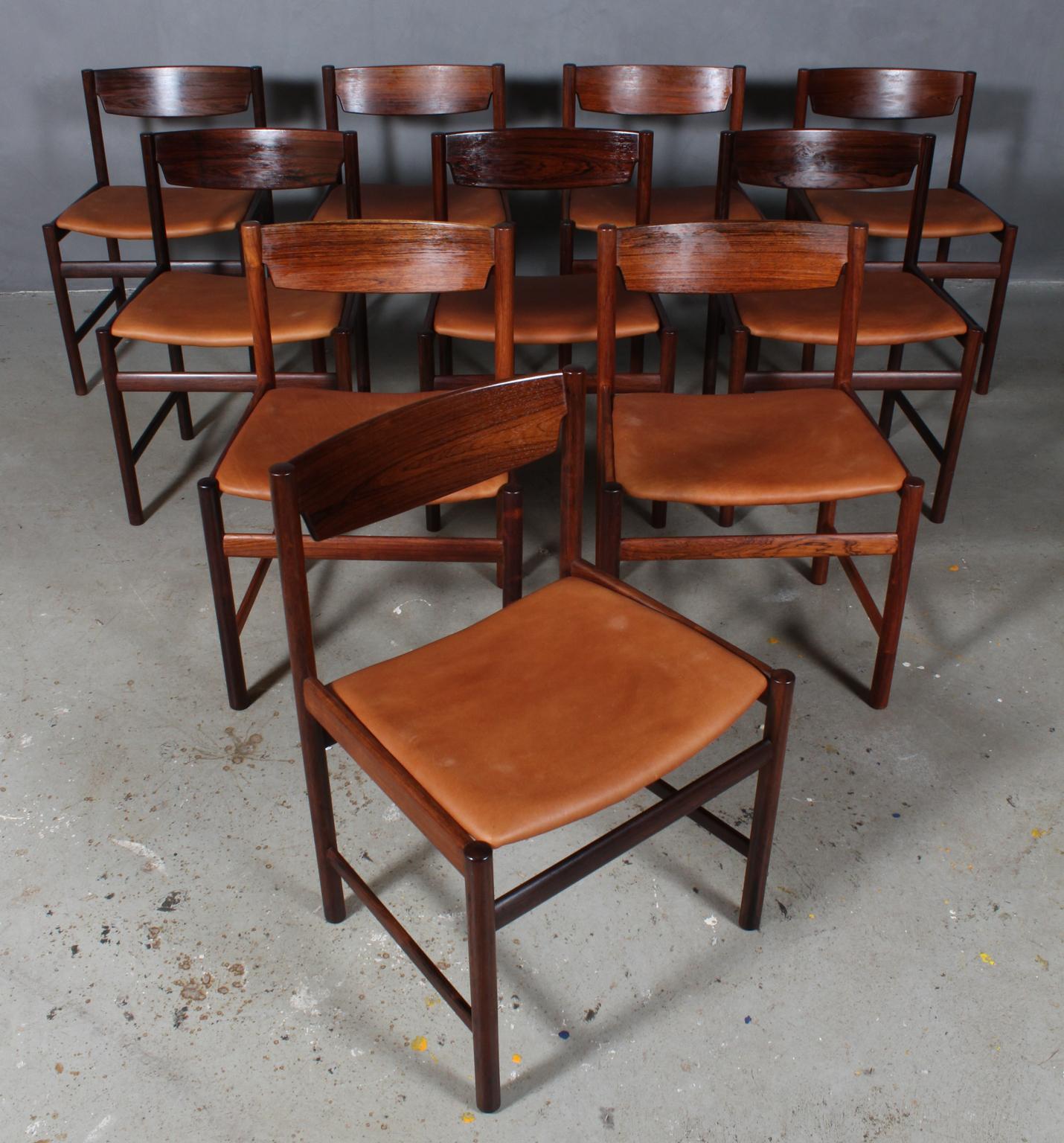 Ib Kofod-Larsen dining chairs in partly solid rosewood.

New upholstered with tan vintage aniline leather.
  