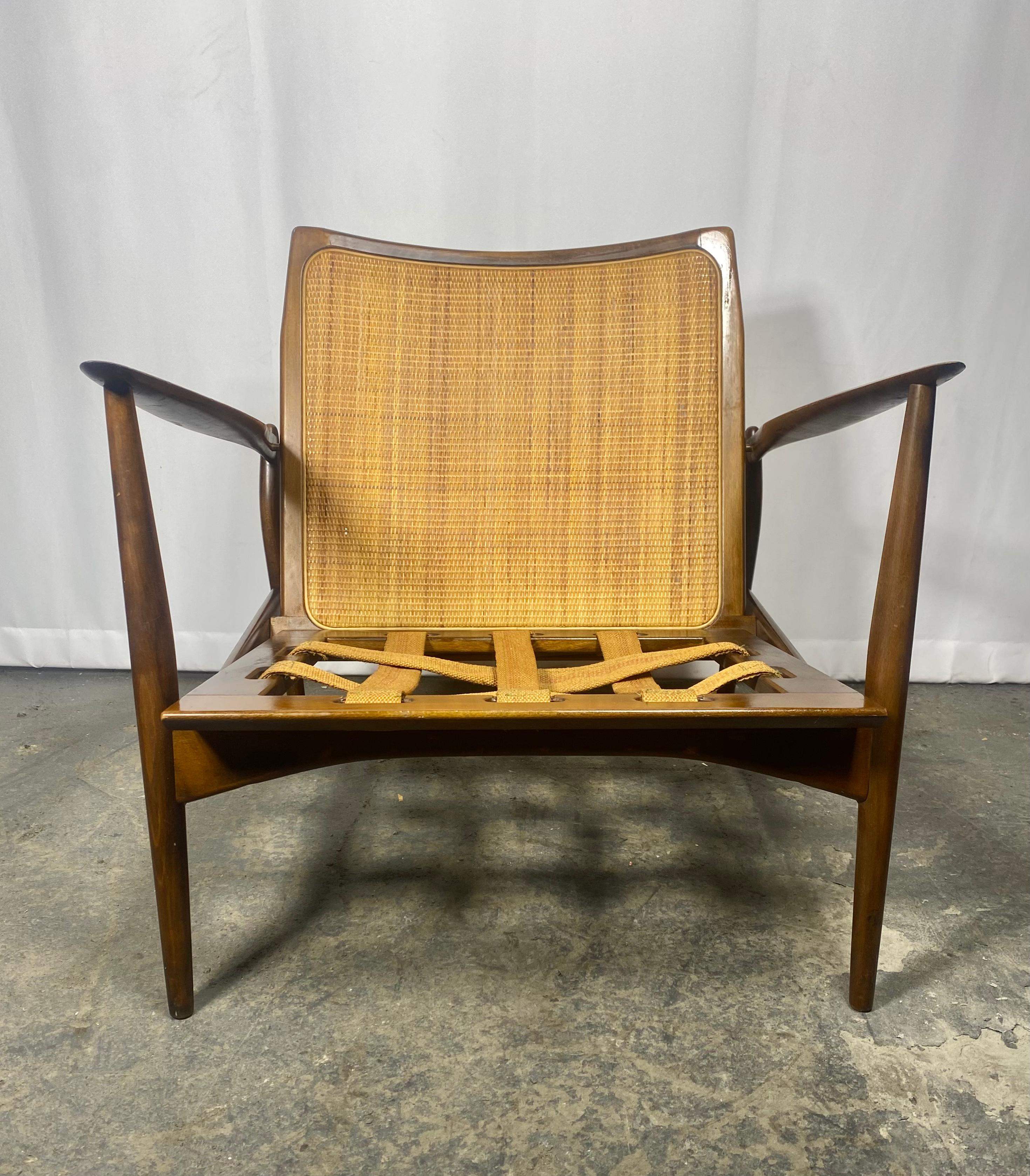 Ib Kofod-Larsen Easy Chair Produced by Selig... Classic Danish Modern,  Stamped MADE IN DENMARK.,, Nice original condition, very minor splits to caning (see photo), also absent of original seat cushion. Amazing design, Perfect addition to your