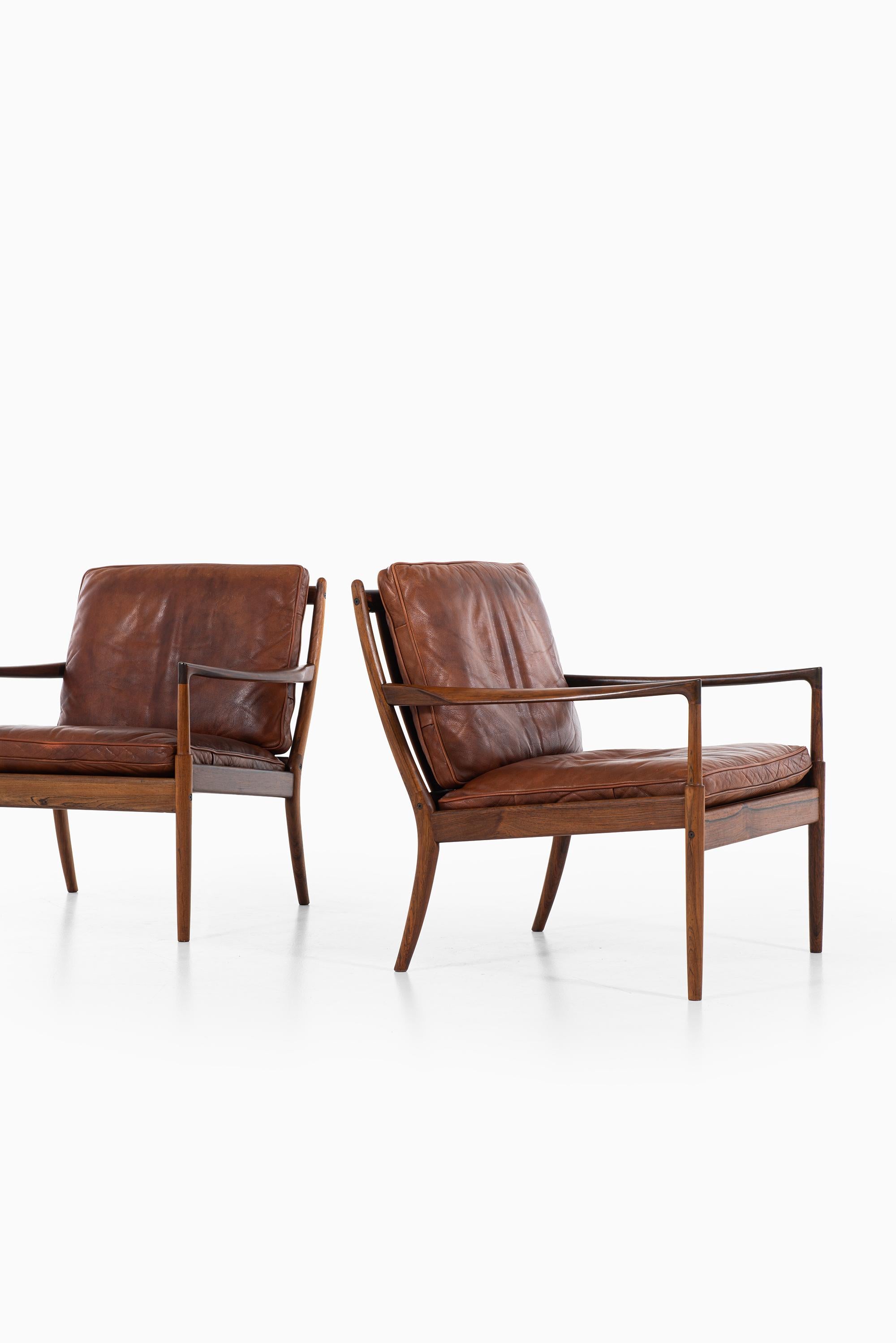 Rare pair of easy chairs model Samsö designed by Ib Kofod-Larsen. Produced by OPE in Sweden.