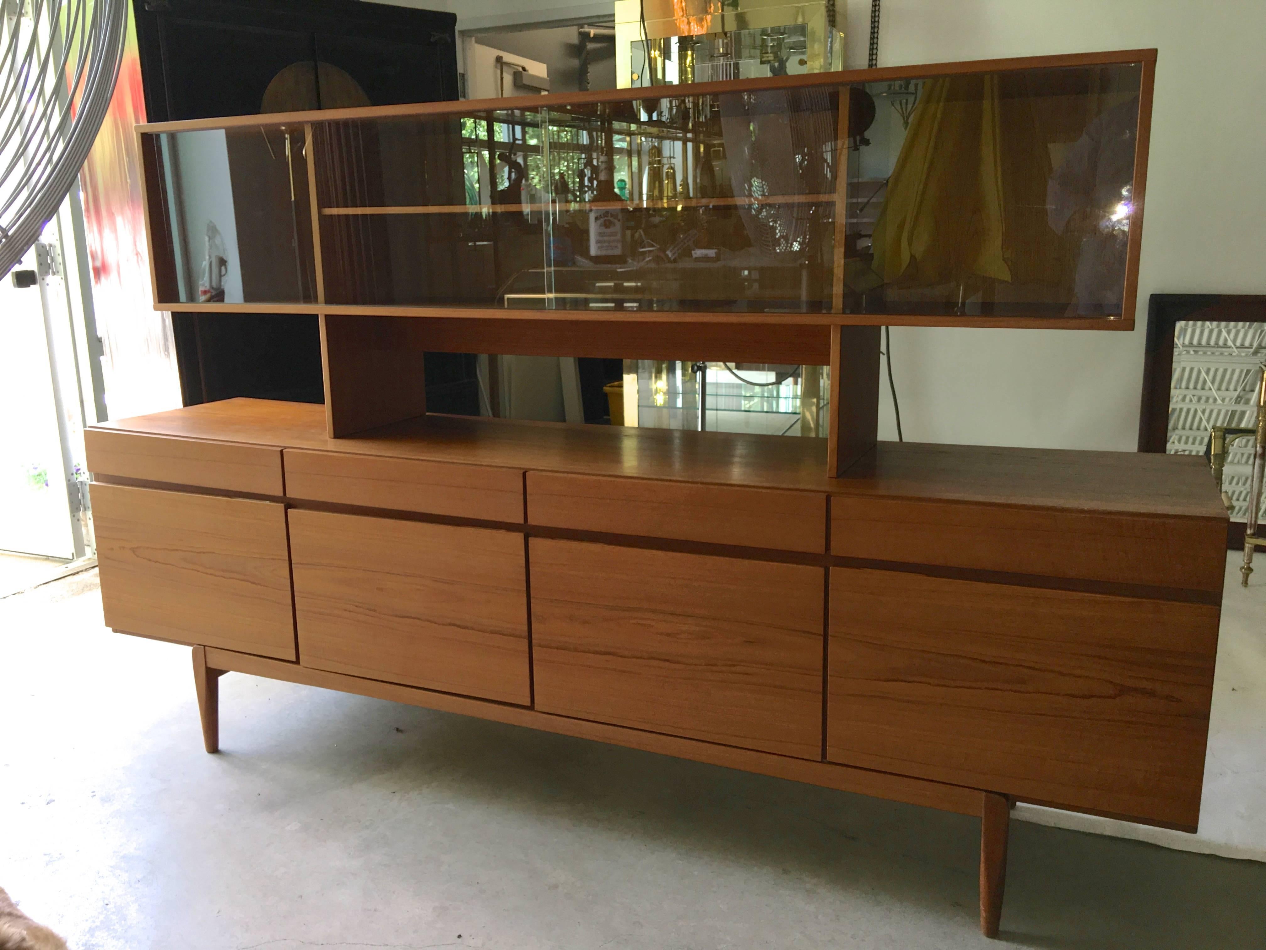 Danish long teak FA-66 credenza sideboard buffet by Ib Kofod-Larsen for Faarup Møbelfabrik, Denmark together with a glass fronted hutch by Jens Quistgaard for Peter Lovig Nielsen. 

Sideboard foil label on back. Hutch brand mark on