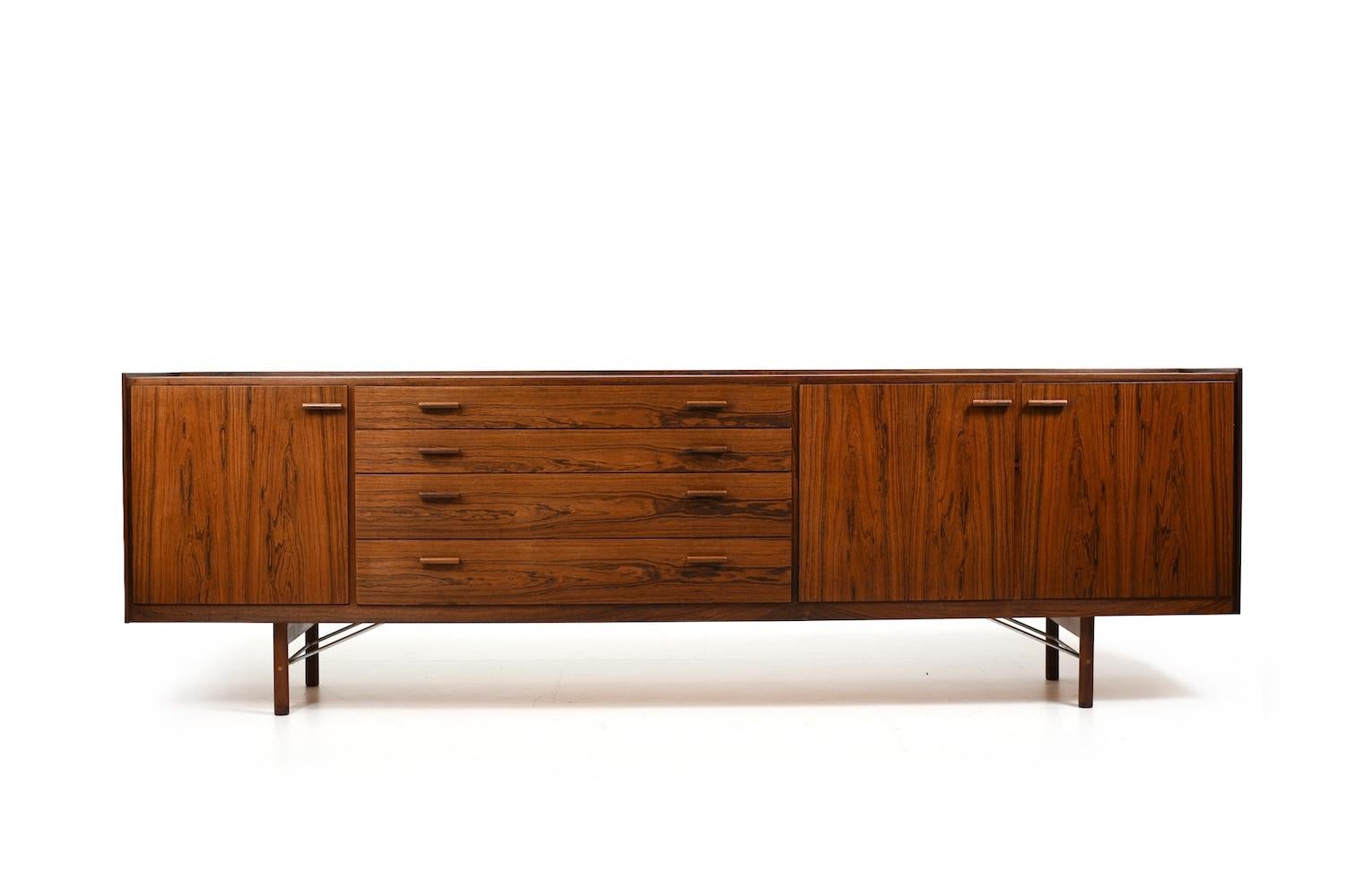 Ib Kofod-Larsen for Brande Møbelfabrik Denmark 1960s. Very fine sideboard with bar, doors , drawers and formica. Legs with beautiful details like chromed steel.