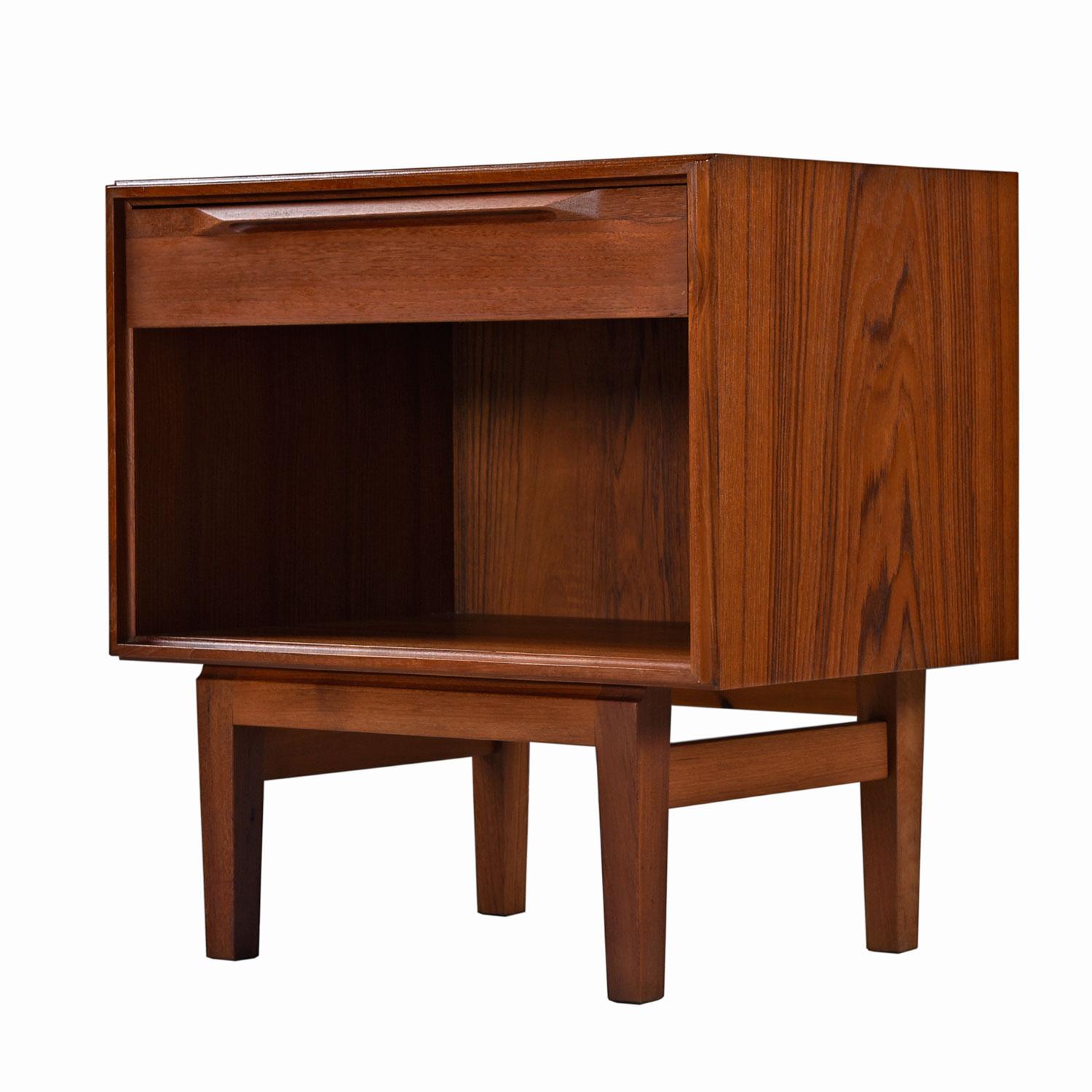 Our restoration team spent many hours restoring these nightstands to like-new condition. There isn't a scratch to be found. 

Expertly crafted Mid-Century Modern Danish teak nightstands by Ib Kofod-Larsen for Fredericia Moblefabrik. These are an