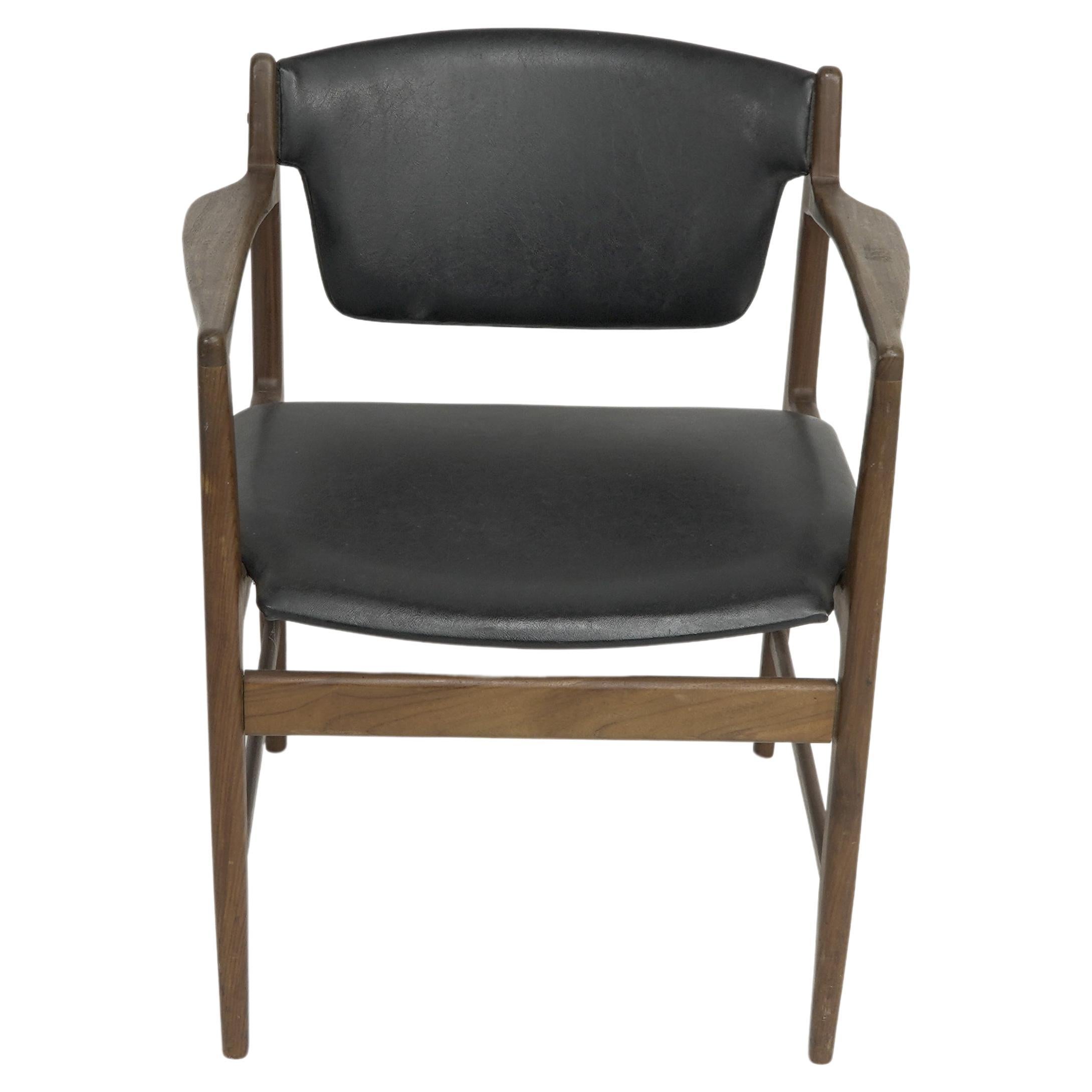 Ib Kofod Larsen for G-Plan Danish Design Range. Teak armchair with gold G Plan stamp and faded Kofod signature underneath the seat . Some tears to sides of seat.
