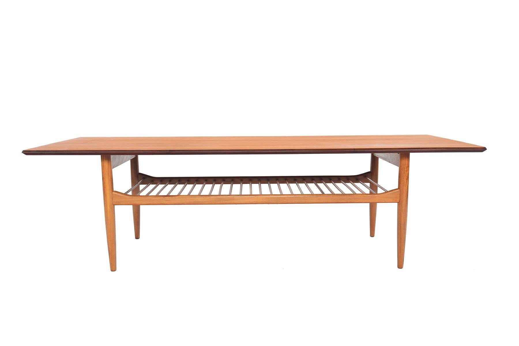 Designed by Ib Kofod- Larsen for G Plan’s Danish range in the 1960s, perfectly detailed coffee table is crafted in teak with clean lines. A lower doweled rack provides storage. In excellent original condition.

 
