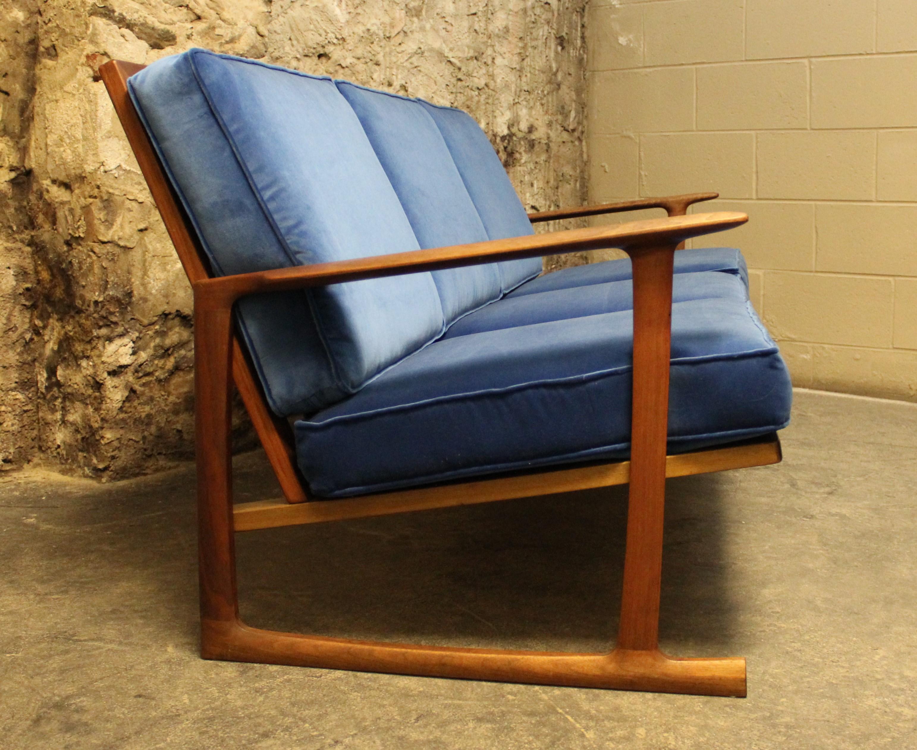 Danish teak sofa by Ib Kofod-Larsen for Selig. Teak frame with sled base. Beautifully executed sofa with ergonomic comfort built in. Recently refurbished and upholstered in blue velvet.

Mid-Century Modern / Scandinavian Modern.