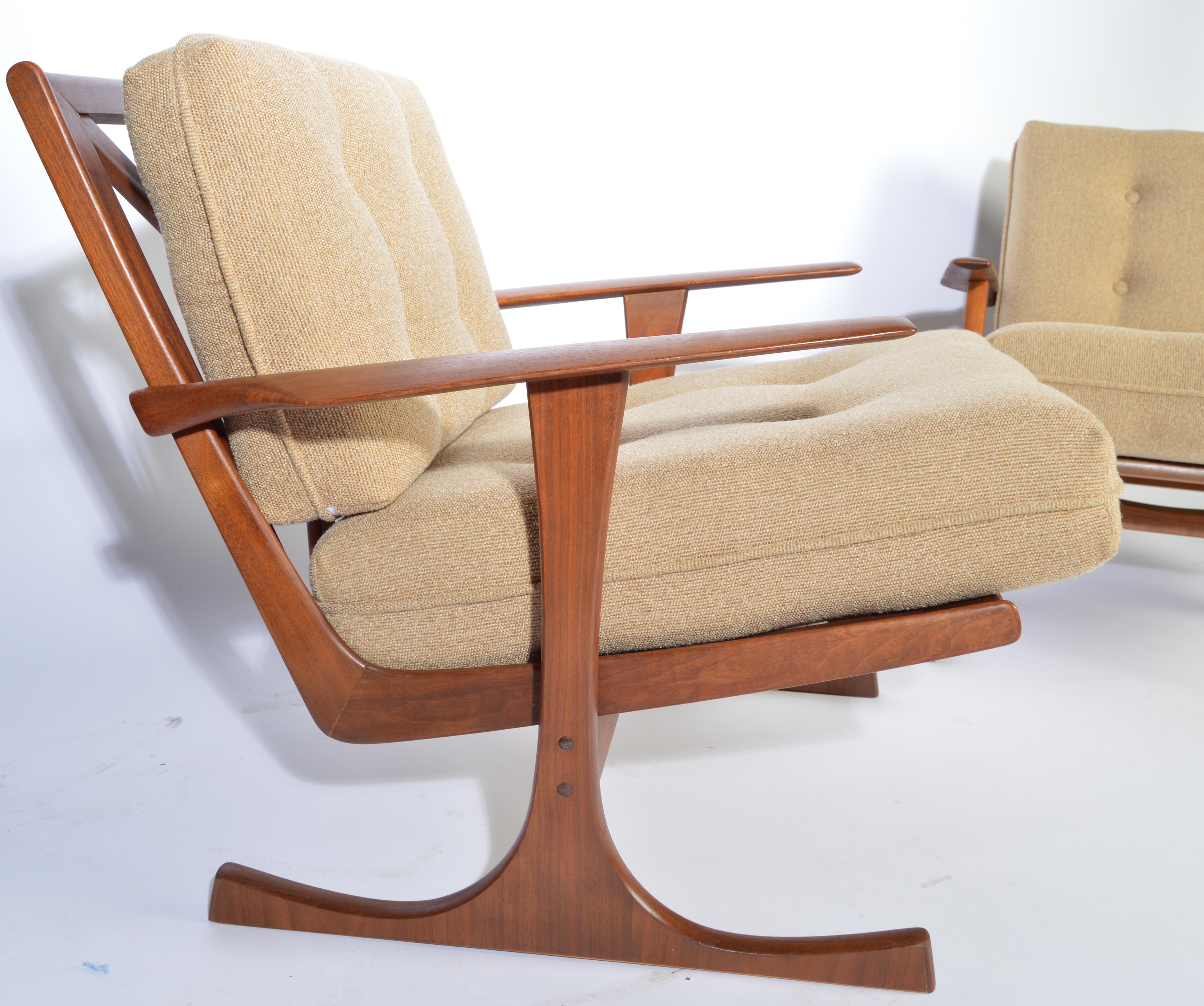 Scarce Ib Kofod-Larsen for Selig-Denmark splayed leg lounge chairs in teak having new Fagas suspension straps.
Outstanding overall condition. Masterfully refinished. Solid and ready for use,
circa 1960.