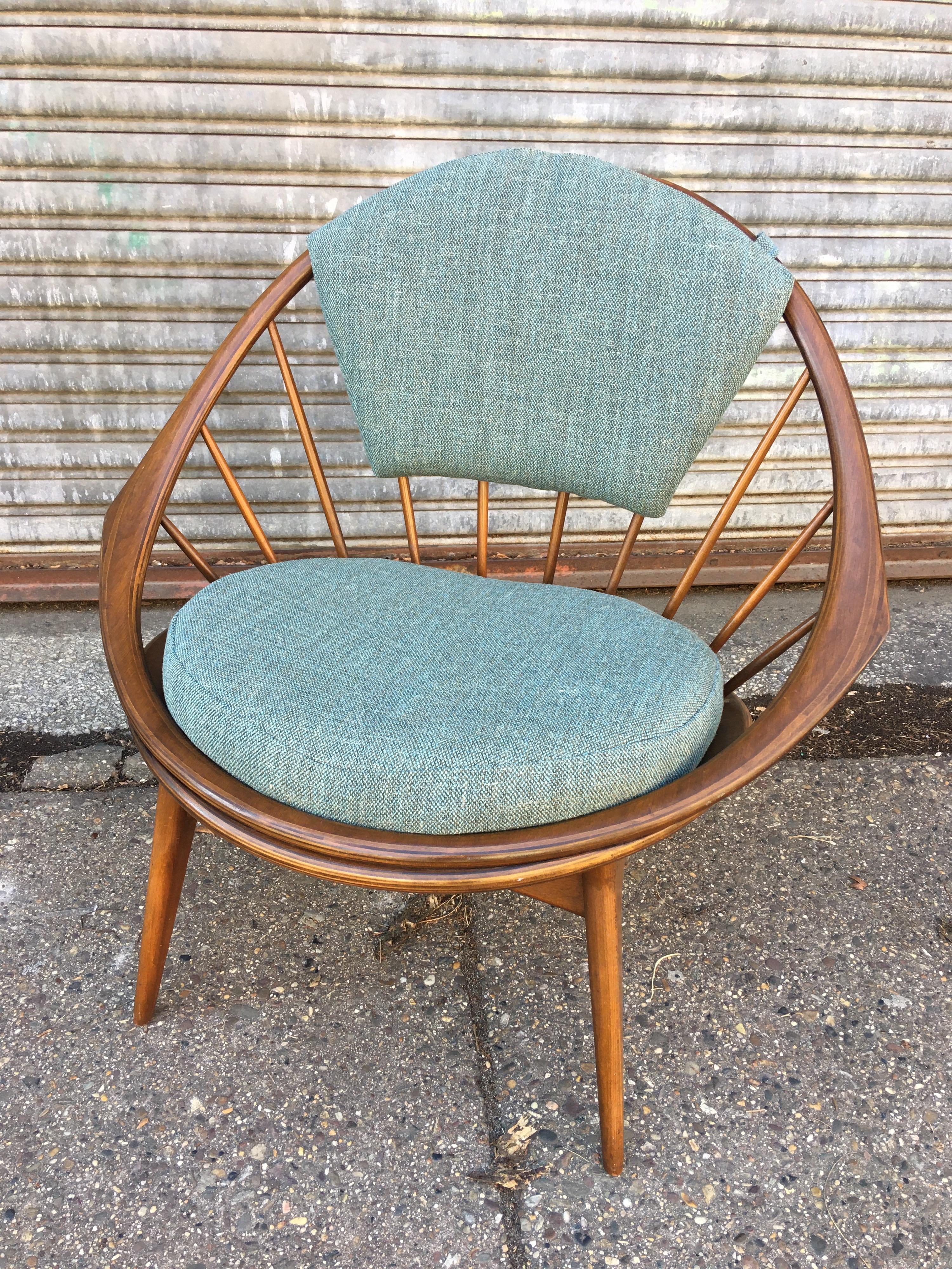 Ib Kofod Larsen for Selig Hoop or peacock chair. Walnut frame with spindle back that loops around with one continuous piece of laminated wood. Original wood finish looks very good! Newly upholstered and ready to go!