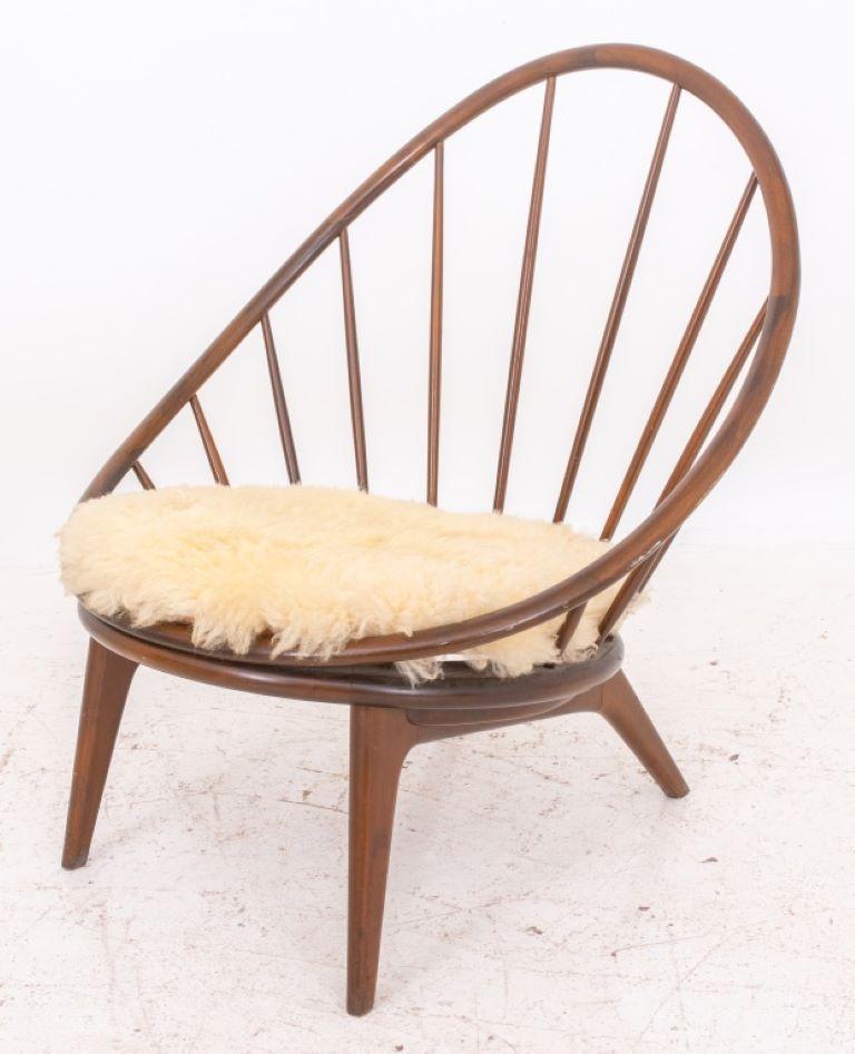 Ib Kofod-Larsen (Danish, 1921 -2003) Selig walnut hoop spindle lounge chair (designed 1959), 1960s, marked 