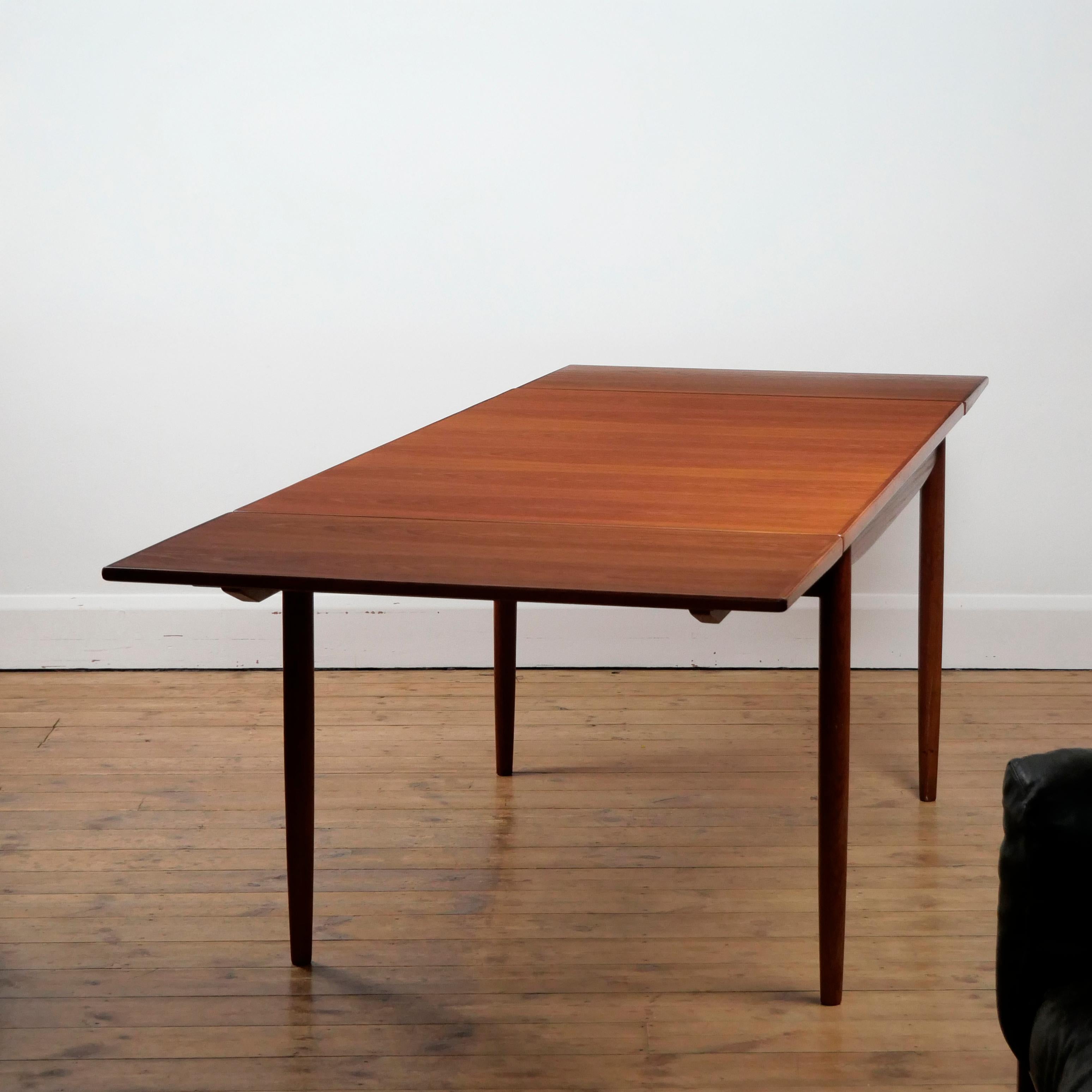 Ib Kofod-larsen for G-Plan
Extending dining table from the G-Plan 'Danish Design' series, designed c. 1962

Teak. Two storable leaves.

Designer / Manufacturer stamp to underside of one of the leaves.

Dimensions: W 88.5 cm, L 152.5 cm extending to