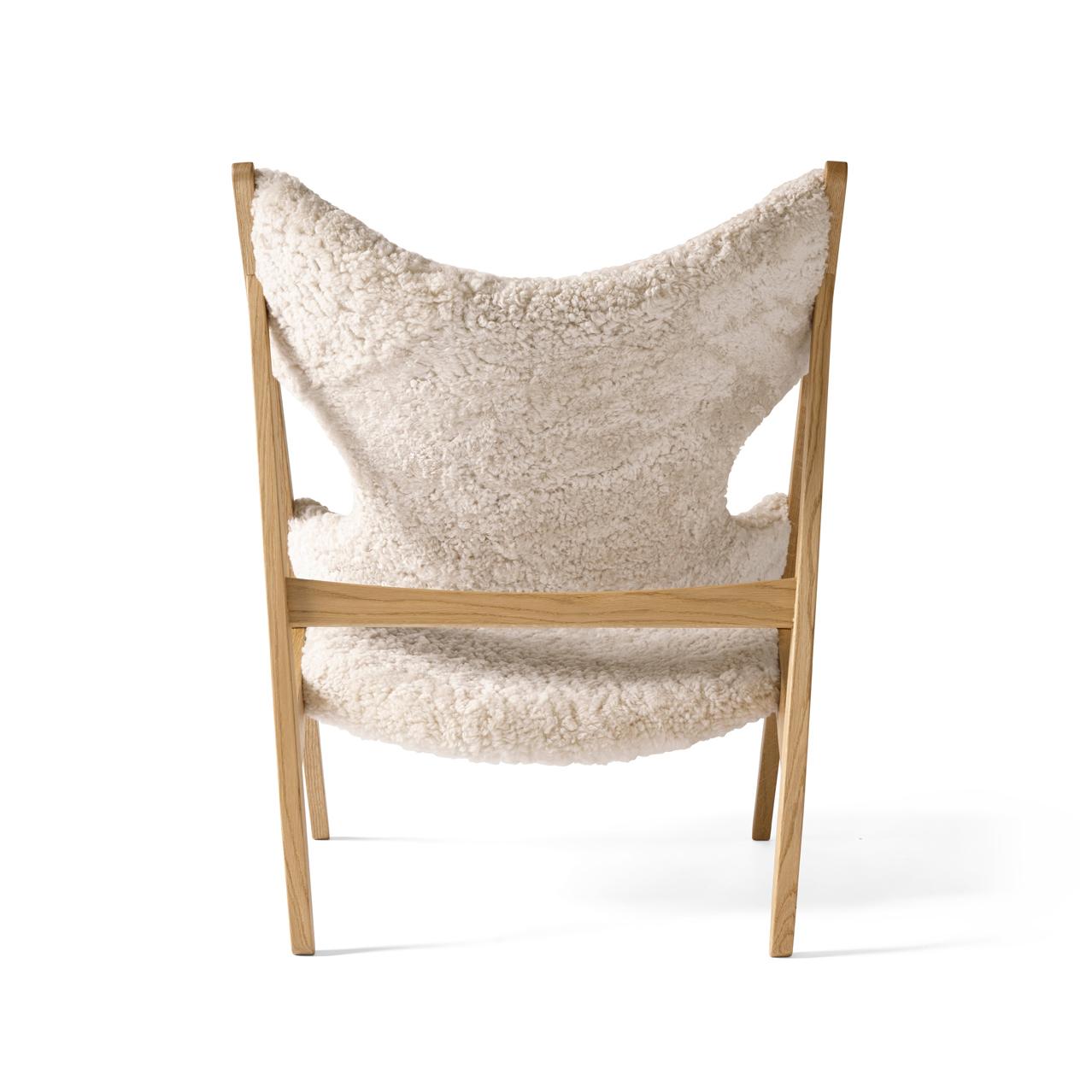 Defined by an exposed, triangular construction, a gently curved seat and back ideally pitched for relaxation, and distinctive cut-outs for resting the elbows when reading (or, of course, knitting), the Knitting chair affirmed Kofod-Larsen’s
