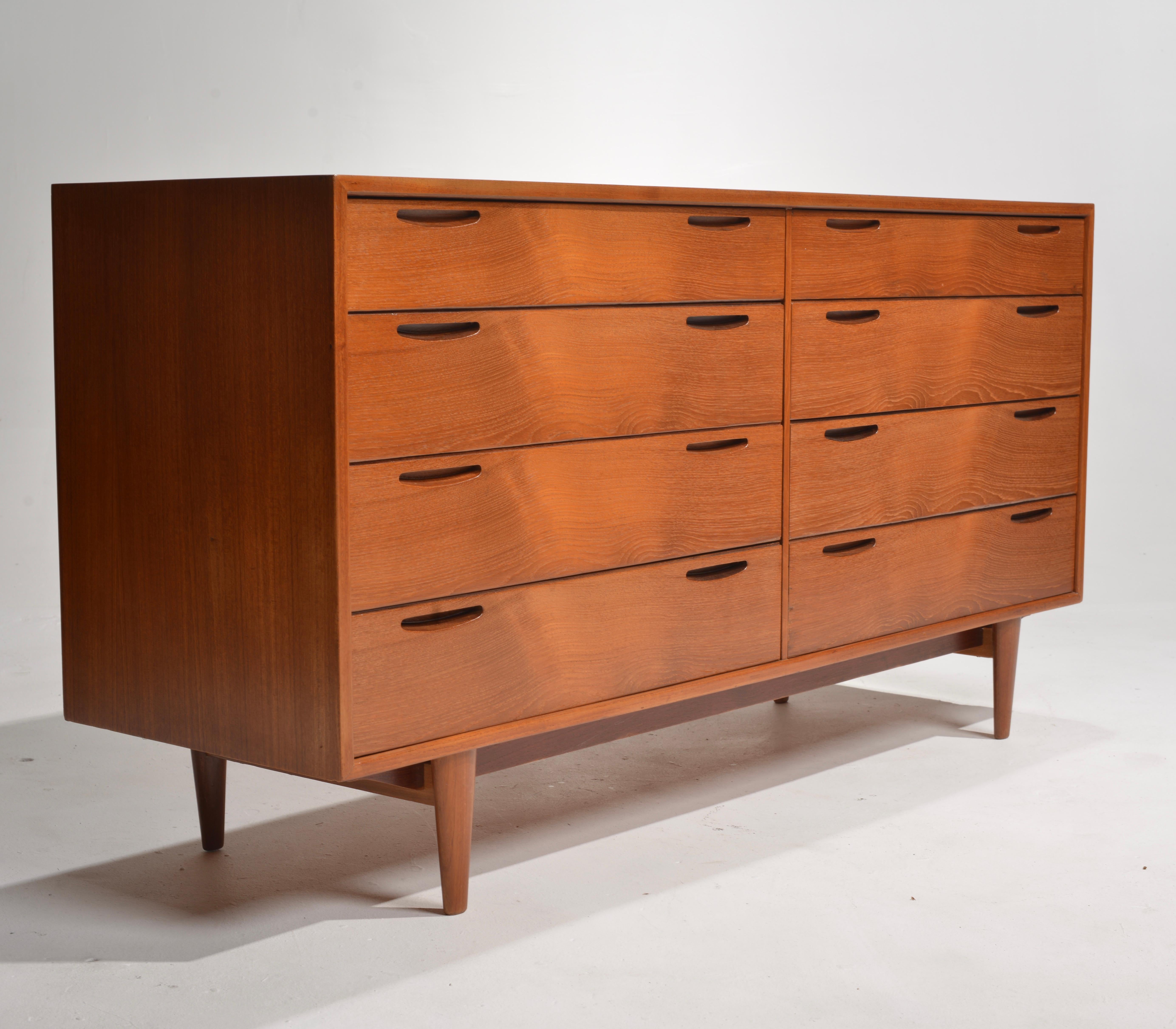 This dresser by Ib Kofod Larsen Dresser in Teak for J. Clausen & Son Brande Mobelf is a stunning example of Scandinavian modern design. Complete with a gorgeous, finished back this piece will fit almost anywhere in your space and be a show-stopper