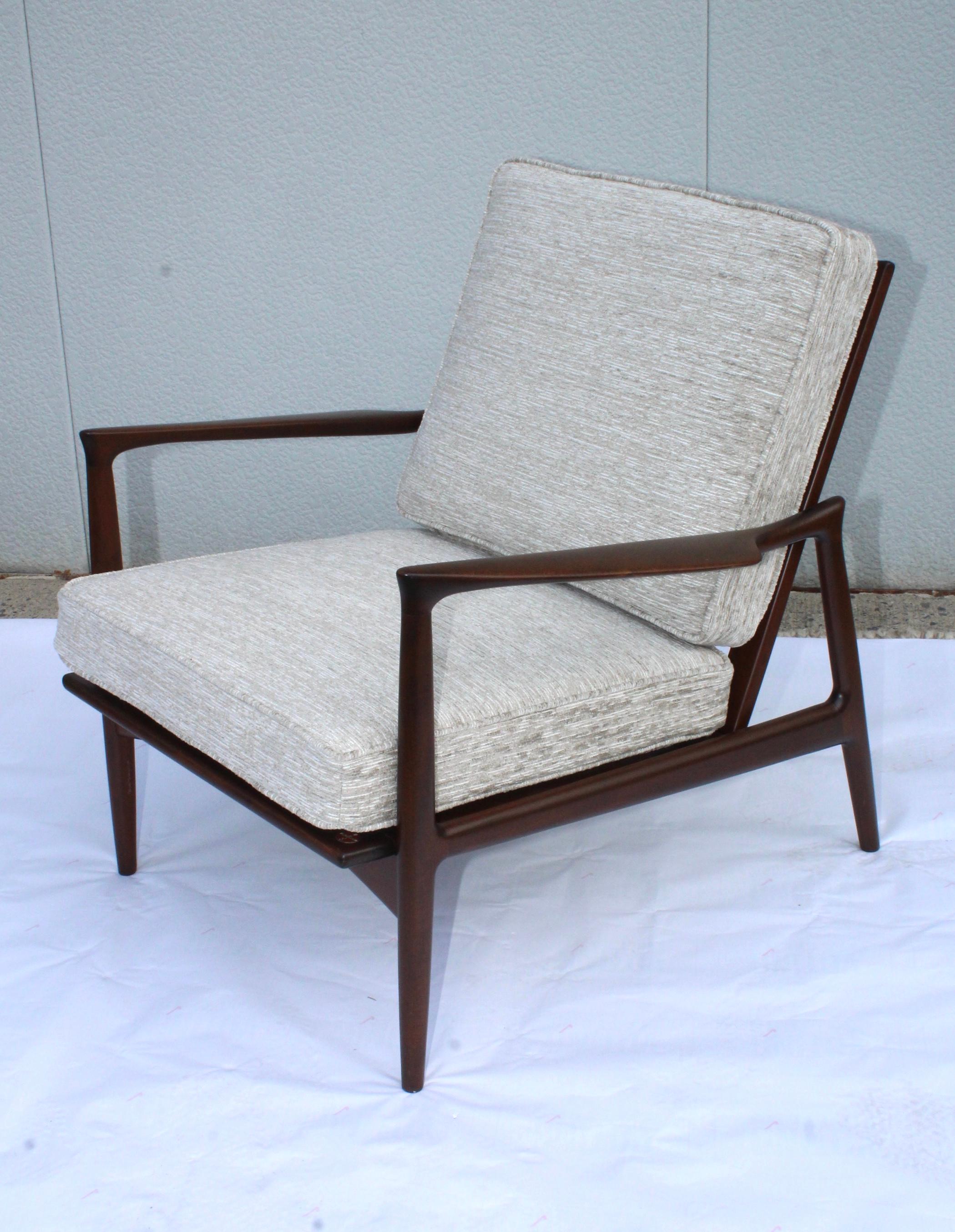 1960s Ib Kofod-Larsen designed for Selig Denmark walnut armchair. Lightly restored with new cushions.
 
  