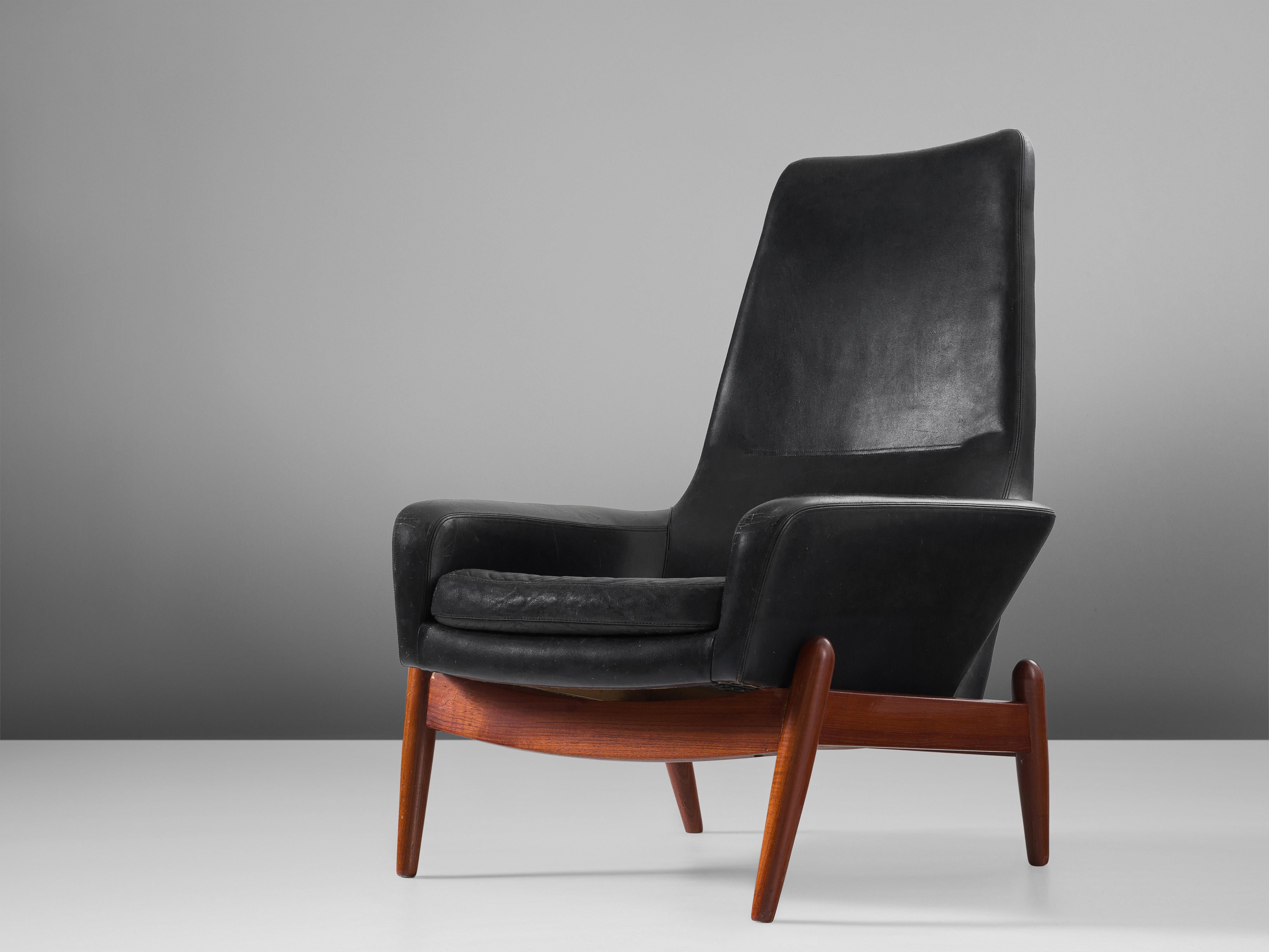 Ib Kofod-Larsen, lounge chair model 'PD30', black leather, teak, Denmark, 1960s.

The designer of this chair, Ib Kofod-Larsen (1921-2003) is known for his distinctive designs features and comfortable materials and simplistic lines, with circular
