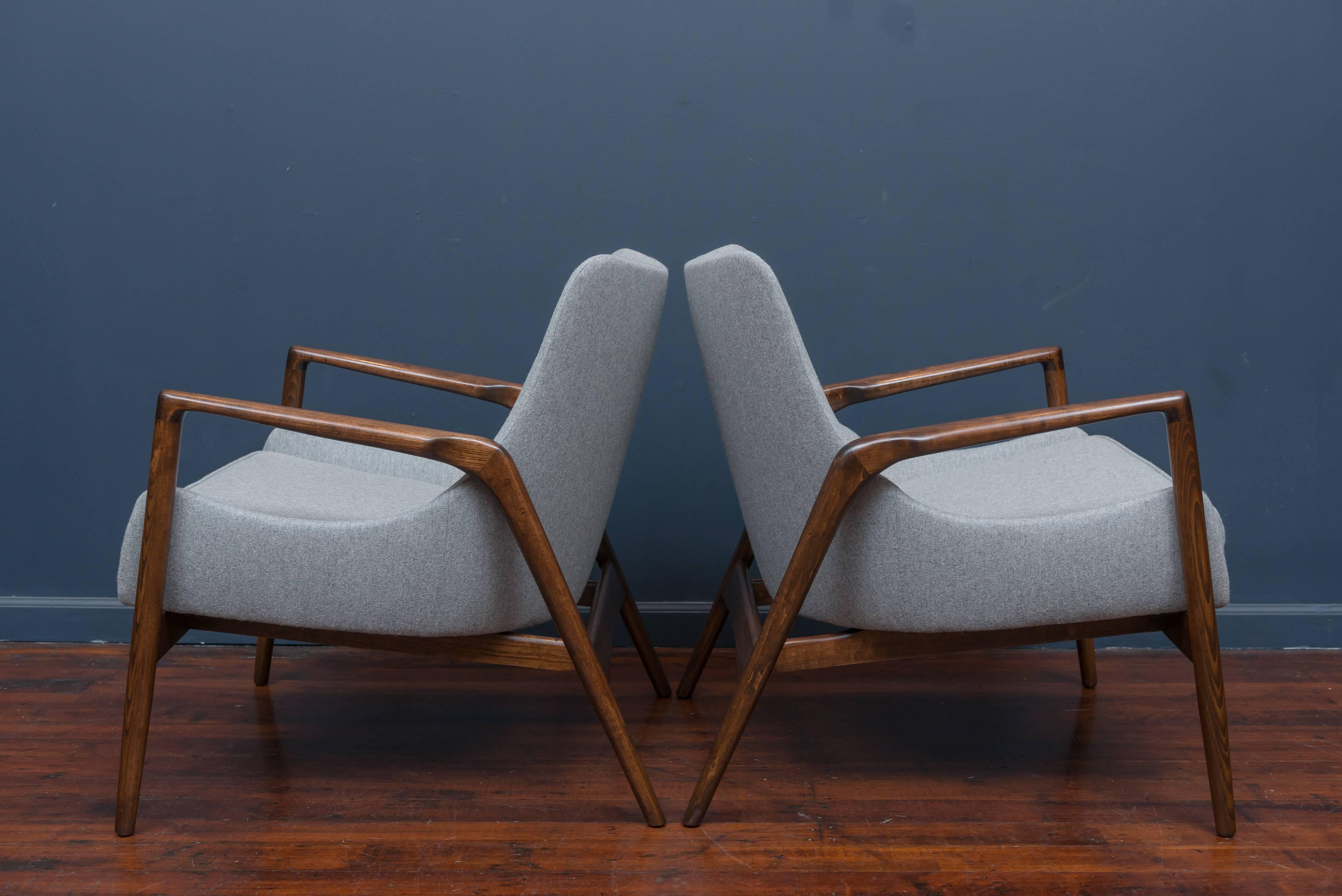 Pair of Ib Kofod-Larsen design lounge chairs, newly refinished and upholstered.