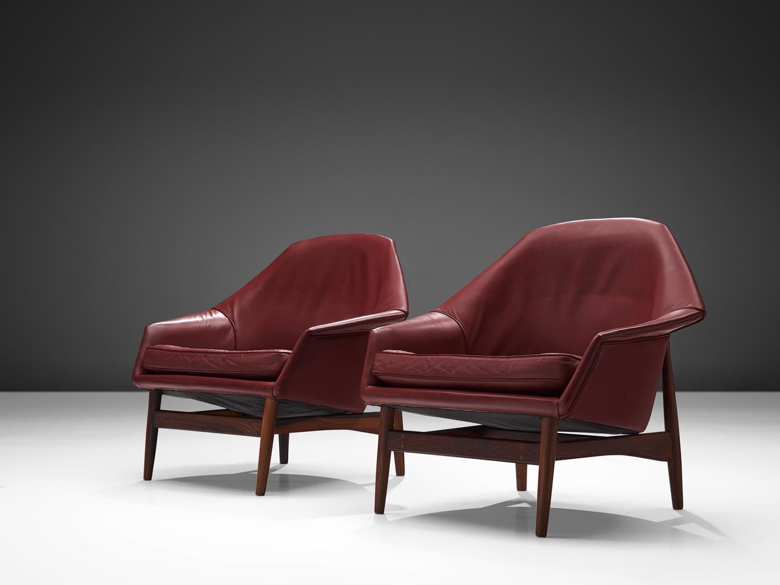 Scandinavian Modern Ib Kofod-Larsen Lounge Chairs in Rosewood and Burgundy Leather