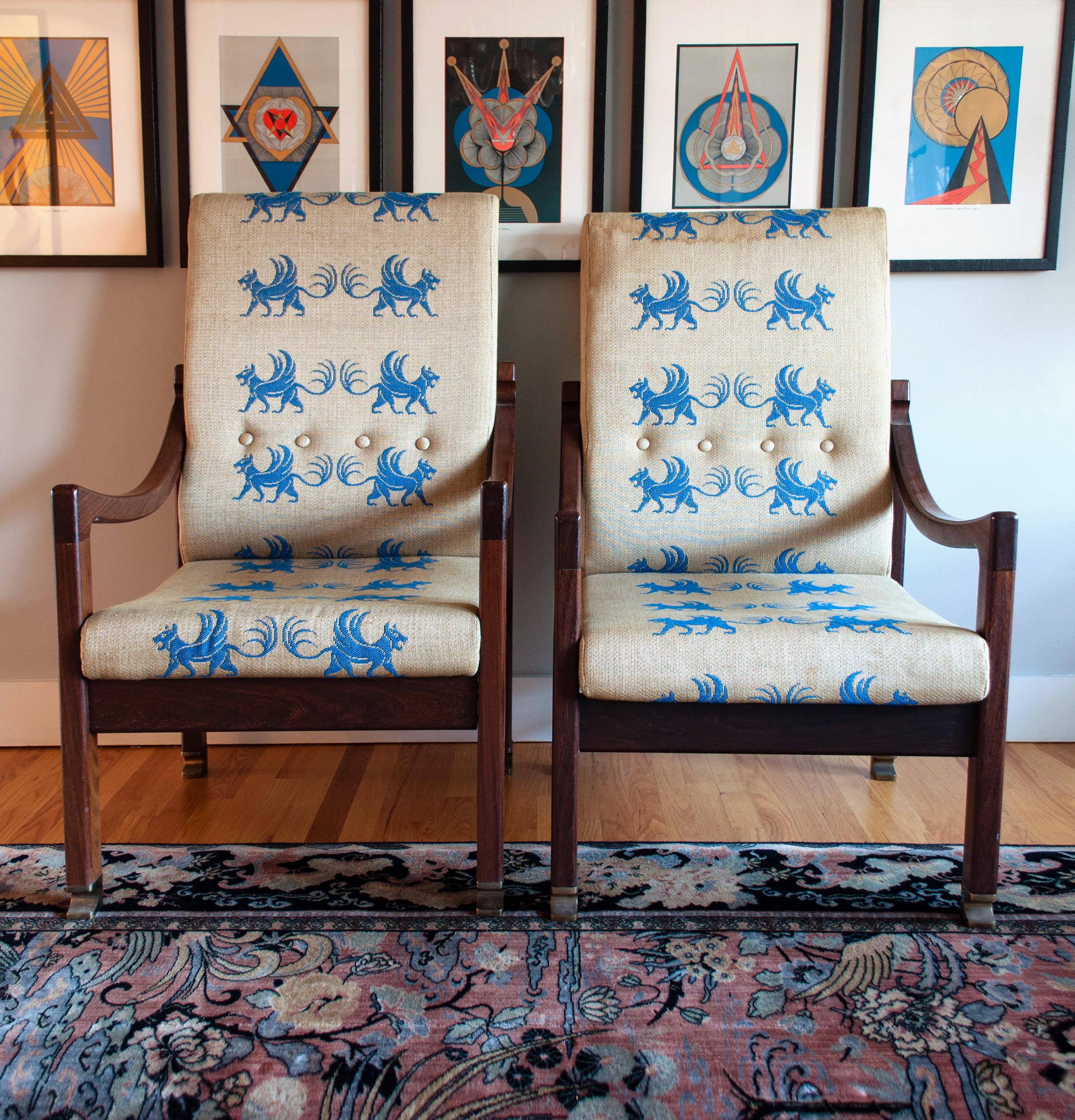 Very uncommon pair of Israeli Mr. and Mrs. chairs from the Megiddo Collection. Designed by Ib Kofod-Larsen and Mendell Selig, the chairs feature their original heraldic fabric, solid brass sabots and stamped maker’s mark on the underside. The design